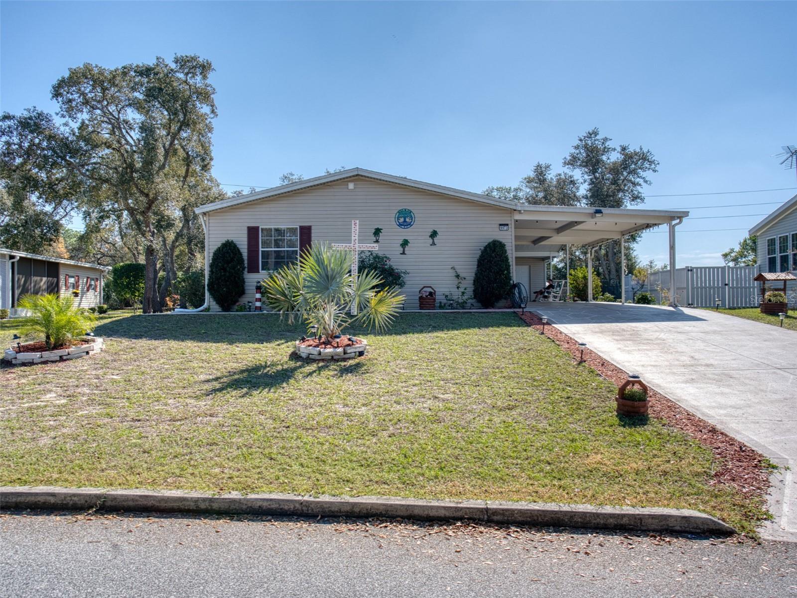 Step into this furnished, move-in-ready 3BR/2BA home and feel the ease of Florida living. Tucked in a quiet, gated 55+ community, it sits on a high, dry lot with peaceful no-build privacy behind. The bright open layout, cathedral ceilings, cozy fireplace, large kitchen, and inviting Florida room create a warm, comfortable space. Practical perks, inside laundry, golf cart garage, storage shed, and a new roof make life simple. For just $48/month, you enjoy a friendly community where you own your land and have resort-style amenities: clubhouse, fitness center, heated pool, sauna, RV/boat storage, tennis, shuffleboard, and a beautiful golf course. Moments away, Weeki Wachee Springs offers kayaking, crystal-clear water, and old-Florida charm, while Weeki Wachee Preserve and the Withlacoochee State Trail invite outdoor exploration. Historic downtown Brooksville rounds it out with local shops and small-town charm. A comfortable home in a place that feels like a getaway every day.