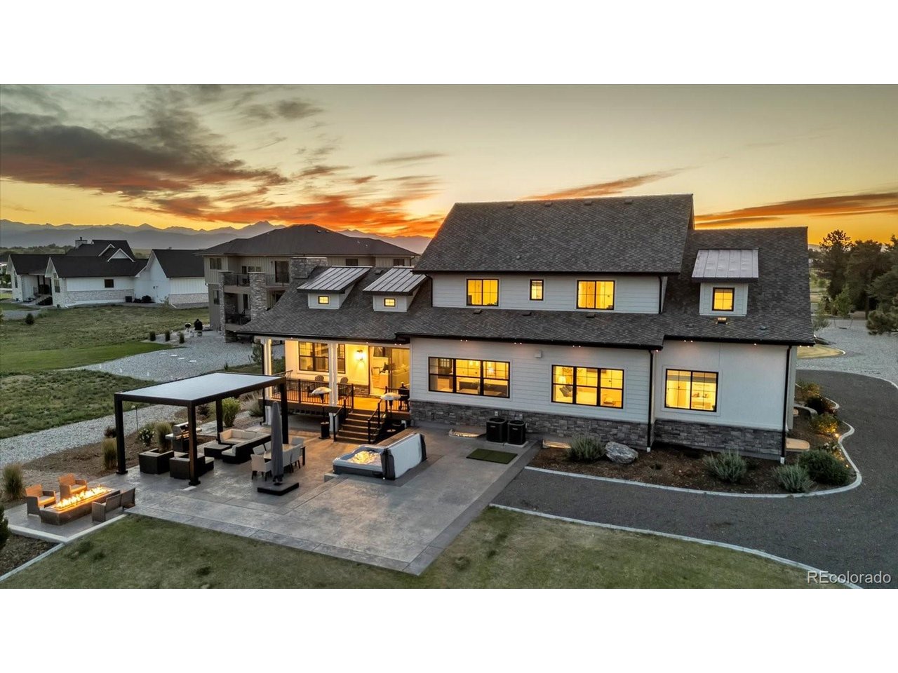 Colorado views, privacy & luxury on 1.18 acres! Nestled in an exclusive community, this exceptional Longmont estate backs to open farmland with no immediate rear neighbors and offers stunning views of Longs Peak, Eldora Ski Resort, and the Flatirons. The open-concept home features soaring ceilings, abundant natural light, a main-level primary suite, six additional bedrooms, a loft, and a finished basement with a home theater and Sonos sound.The professionally landscaped backyard is built for entertaining with a remote-operated louvered pergola, Bullfrog Spa, oversized gas fire pit, in-ground trampoline, and irrigated raised garden beds. Additional highlights include dual HVAC, tankless water heater, EV charger, permanent JellyFish lighting, and space for a future 1,200 SF outbuilding, RV garage, pool, or putting green. Covenants allow up to four hens. A rare blend of acreage, privacy, panoramic views, and Colorado lifestyle-all minutes from I-25.