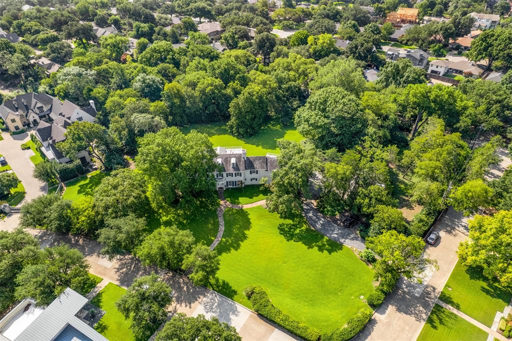 A once-in-a-generation opportunity in the heart of Lakewood. Hidden beneath a canopy of trees, this 2.86-acre Dallas estate unfolds across multi-terraced grounds with a spring-fed pond and timeless serenity. Offered for the first time in three decades, the property evokes a sense of sanctuary and heritage rarely found within the city. The existing 1940 home offers charm and history, but the site itself invites vision—a place to craft an estate of enduring significance. Now offered at $9 million, reduced from $10.5 million, this is your chance to own one of Dallas’ most remarkable private settings. Located in what was originally called Marcus Estates, the only true estate area in Lakewood that was developed by the Marcus family of Neiman Marcus fame. This site is contiguous with all all Marcus estates via a 20 acre forest within the bounds of the roadways that surround it. Once only 4 estate homes, now through the years there are but 12 homes within the original 25 acres.
