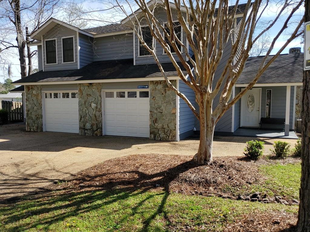 Duplex offers 1600 sq. ft. each side with master with ensuite and 3 bedrooms 2 baths each side with a vaulted ceiling great room and fireplace looking out over the beautiful lake adjoining this property. Kitchen with breakfast bar and dining room opening to the deck. Dock on the lake. Each unit features a full garage with safety garage door. This set up is ideal for you to be the homeowner in one side and landlord in the other letting your tenant make the mortgage payment with rent. Location is a premium within walking distance to shopping centers, big box stores, pharmacy and lots of eating restaurants and post office.