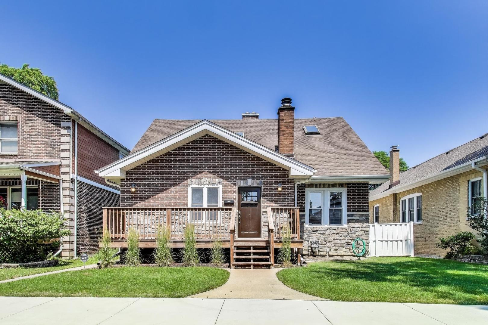 Absolutely Stunning Home in Norwood Park! Nestled on a picturesque, tree-lined street, this 4-bedroom gem offers the perfect blend of space, style, and comfort. One bedroom on the main level is currently set up as a home office, ideal for remote work or guests. Step into the impressive two-story living room, flooded with natural light from skylights and vertical windows. Soaring vaulted ceilings, gleaming hardwood floors, and a cozy fireplace create a dramatic yet inviting space. The formal dining room with elegant wainscoting can also serve as a family room, offering flexibility for your lifestyle. The updated eat-in kitchen features a breakfast bar, granite countertops, and stainless steel appliances - perfect for everyday living and entertaining. Upstairs, the open staircase leads to a loft that overlooks the living room, adding architectural interest and light. The luxurious primary suite is a true retreat with vaulted ceilings, a Juliet balcony, a walk-in closet, and a spa-like shared bath boasting a jacuzzi tub, separate shower, and double vanity. The finished basement adds extra space and includes a dedicated laundry area. Then there's the yard! An oversized lot with a spacious deck that's perfect for entertaining or unwinding in your private outdoor oasis. Topping it all off is an expansive 3-car garage with three overhead doors, charming French doors, and a walk-up attic providing ample storage space. This Norwood Park beauty has it all. Don't miss your chance to call it home!