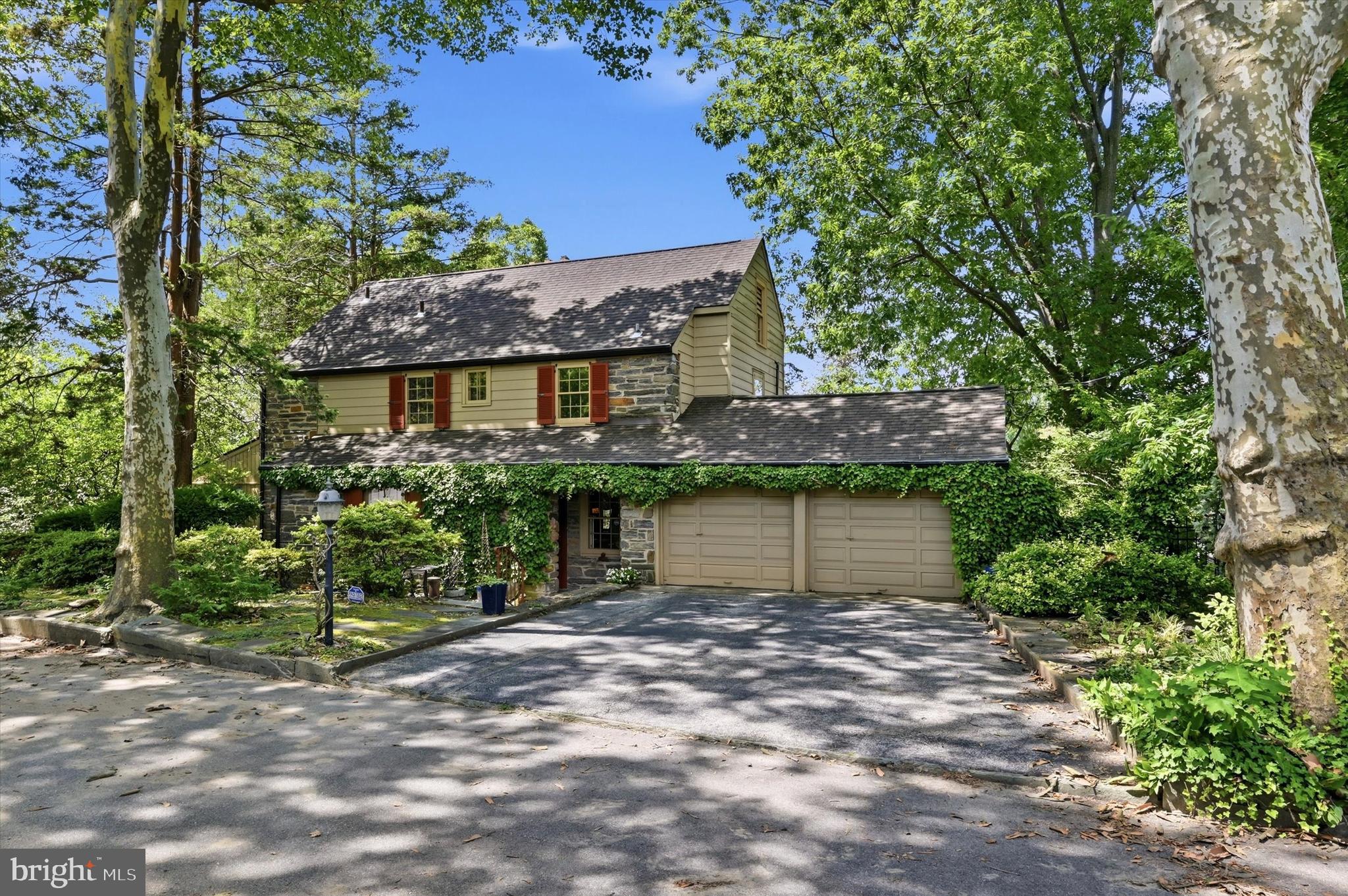 First time on the market in 50 years,  lovingly maintained and improved by thoughtful  owners is  this handsome all stone colonial.  Sought after Penn Wynne location, close to parks, trolley, the Main Line  and award winning Haverford Township Schools. Offers a rarely found 2 car attached garage with opener AND off street parking . A fabulous home for entertaining with rooms that easily flow. The first floor is expanded by a spacious vaulted beamed ceiling bonus room with exposed stone wall  fitted with a wet bar, office area, built in cabinetry and picture windows. Foyer entrance with  large hall closet and turned staircase leads to oversized living room with fireplace, built in shelves, deep windowsills and oak hardwood floors. Living room seamlessly opens to formal dining room with built in corner cabinet with glass arched doors and custom cabinetry. Dining room exits to covered terrazza for delightful outside entertaining. The kitchen is the heart of this home -  many fabulous meals and wonderful memories are made here.   It offers a new electric range, updated dishwasher, abundant cabinetry, pantry  storage, meal prep space and a cozy breakfast bar for two - a great place for a coffee and a chat.   The kitchen entry leads to a covered alcove with bench, a charming stone walled garden with slate floor patio and  easy garage/driveway access.   A darling wood paneled breakfast room is adjacent to the kitchen and returns to the entrance foyer. The breakfast room is the perfect way to expand the kitchen if desired. Upstairs is  a primary bedroom en suite with full bath and cedar lined closet, two additional nice size corner bedrooms and ceramic tile hall bath. and hallway storage. Hardwood floors below carpet. The walkout  lower level has a great recreation room with a large stone fireplace focal point. A laundry room, hobby workshop, powder room with wine closet, mechanical room complete this level.  Gas hot water heat, 2022 gas water heater,  200 amp electrical,  2018 roof, central air for second floor and wall units for first floor. This is a wonderful opportunity to own a great "forever" home. Ideally located near parks, schools and all the Main Line has to offer. Put it at the top of your list! Open Sunday July 26 from 2-4.