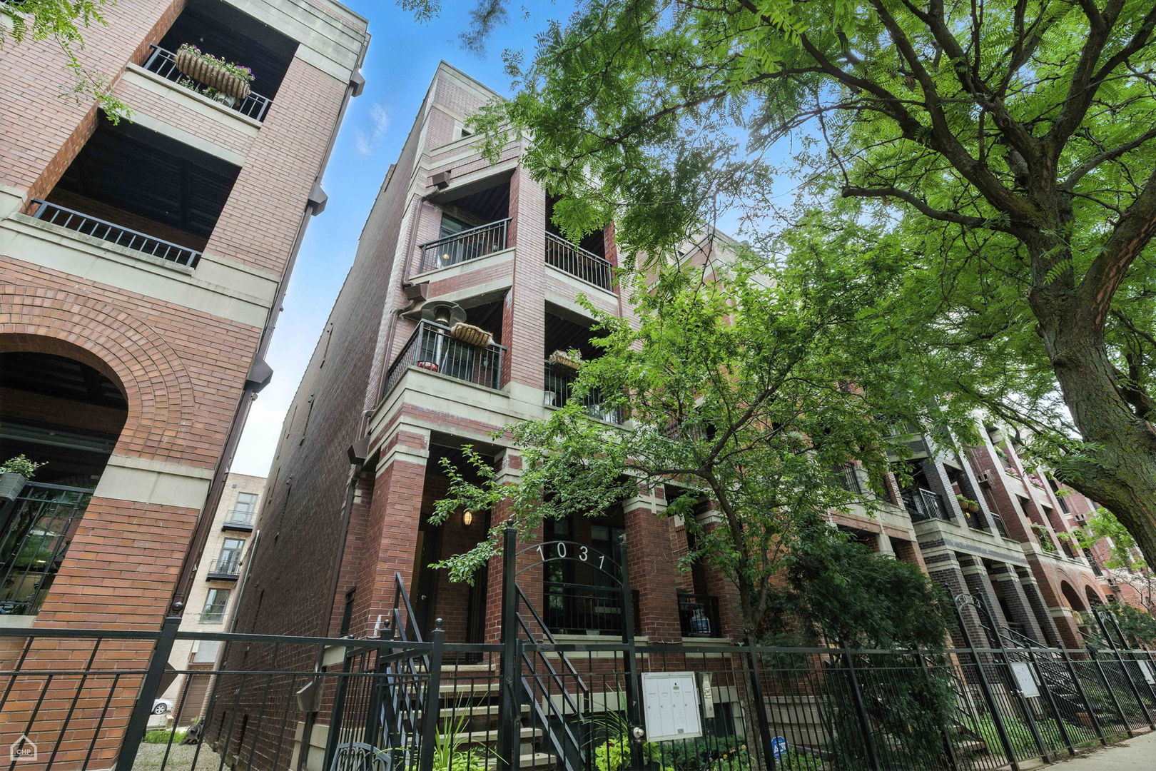 Experience penthouse living at its finest with this rare opportunity to own a designer home featuring unmatched outdoor space in the heart of the West Loop. Welcome to a completely gut-rehabbed stunner where no detail has been overlooked. This 2-bedroom, 2-bathroom, 1,500 sq. ft. home offers a perfect blend of sophisticated design and modern comfort, located in one of the city's most desirable neighborhoods.     The open-concept living and dining area flows seamlessly to a private balcony, ideal for enjoying your morning coffee or grilling while taking in stunning skyline views. The home features gorgeous wide-plank hardwood floors, crown molding, and dramatic floor-to-ceiling windows.     The designer kitchen is a showpiece, boasting quartzite countertops, stainless steel appliances, a wine fridge, and a large breakfast bar perfect for entertaining guests.     The sun-filled primary suite offers spacious closets and a luxurious, spa-like ensuite bathroom. This bathroom features dual vanities, Restoration Hardware fixtures, a jacuzzi tub, and a steam shower equipped with jetted sprays and a rain showerhead.     One of the standout features of this home is the incredible, professionally designed private rooftop deck by Reveal Design. This amazing space is fully equipped for year-round enjoyment, featuring a steel pergola with adjustable shades, custom built-in seating and storage, a gas-plumbed fire pit, commercial-grade outdoor heaters, a custom bar, smartphone-controlled lighting, hardwired outdoor speakers, and professional landscaping.     Additional highlights include built-in surround sound with in-ceiling speakers, a Nest thermostat, and garage parking. The home is located in the highly-rated Skinner School District, placing you within walking distance to everything the West Loop has to offer - restaurants, shops, transit, parks, and more!