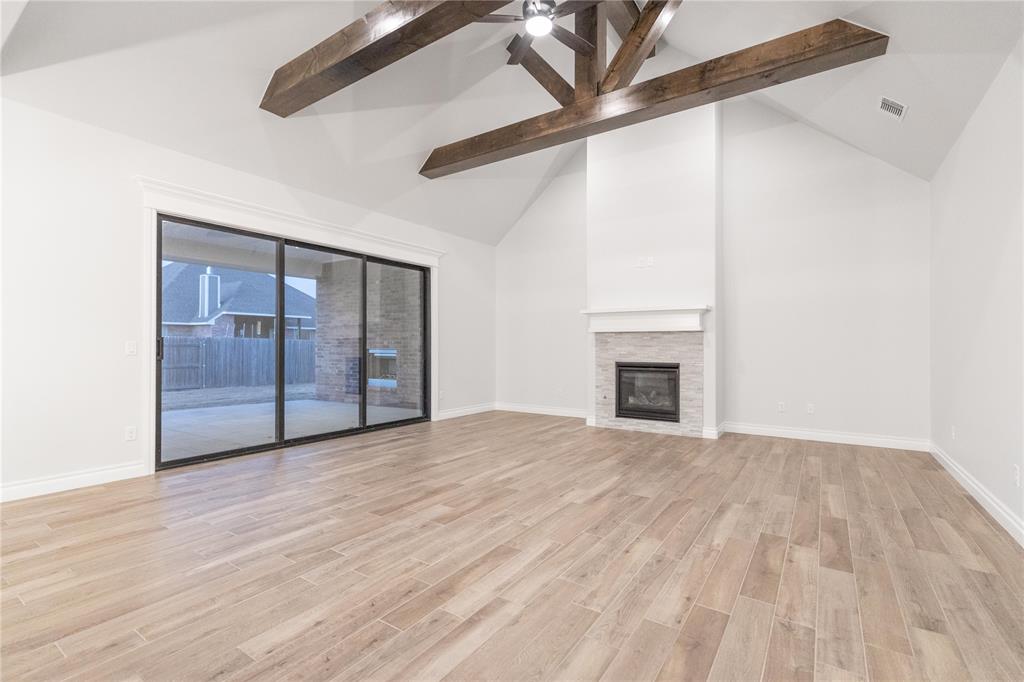 This Wesley Bonus Room floor plan includes 3,630 Sqft of total living space, which features 3,285 Sqft of indoor living space and 345 Sqft of outdoor living space. There is also a 590 Sqft, three-car garage with an in-ground storm shelter installed! This desirable home offers 5 bedrooms, 3 full bathrooms, covered patios, a large bonus room, a powder room, and a utility room featuring a utility sink. The great room supports an immaculate cathedral ceiling with a crows feet detail and a ceiling fan, a luxurious 3-panel sliding door with a 4’ back patio extension, wood-look tile, rocker switches throughout, Cat6 wiring, eggshell paint, and a center gas fireplace surrounded by our exquisite stacked stone detail. The upscale kitchen boasts stunning pendant lighting, stainless steel appliances including double ovens and a 5-burner cooktop, 3 CM countertops, vogue tile backsplash, well-crafted cabinets to the ceiling with cabinet hardware throughout and under cabinet lighting, decorative end panels, a separate walk-in pantry, and a large center island that holds a roomy sink, a dishwasher, and a trash can pullout. The primary suite provides a sloped ceiling detail, a ceiling fan, a plush carpet finish, and windows. Attached is the main bath, which has a bat-winged vanity with framed mirrors, 3 CM countertops, a large European walk-in shower, a private water closet with an elongated toilet, a free-standing tub, and a HUGE walk-in closet! The covered outdoor living area welcomes a wood-burning fireplace, a gas line for your grill, and a handy TV hookup. Other included features for this elegant home include our healthy home technology, an air filtration system, a tankless water heater, double glazed vinyl low E windows with argon, R-44 and R-15 insulation, a fresh air ventilation system, and so much more!