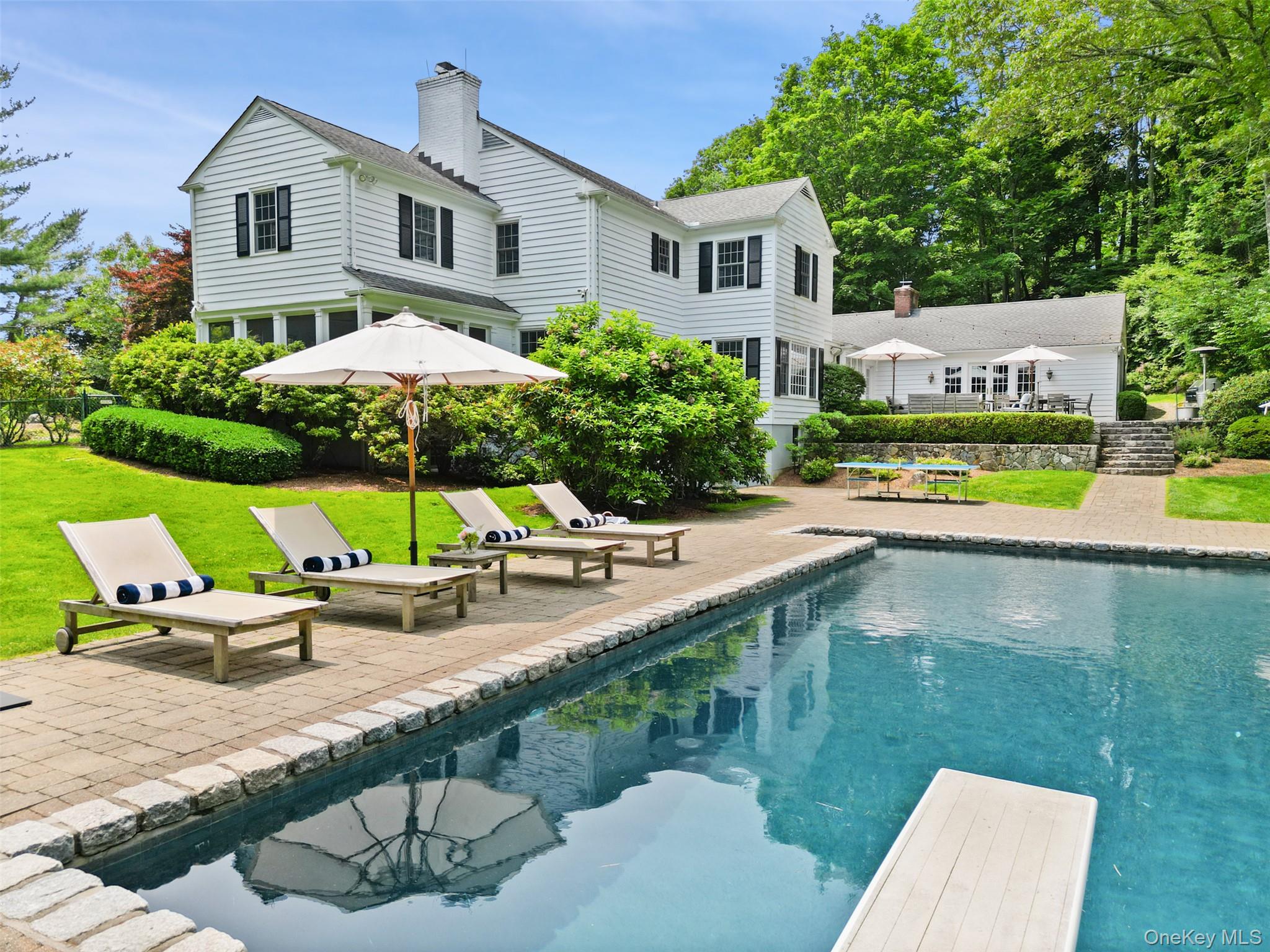 Rare opportunity to move right into one of the most beautiful homes in the area! This fully renovated 5BR, 4 full & 2 half bath Colonial sits on 2.46 private acres at the end of a cul-de-sac in one of Chappaqua’s most coveted neighborhoods. Blending timeless charm with modern updates, the home features a chef’s kitchen with high-end appliances, sun-filled living spaces, custom millwork, and an ideal layout for everyday living and entertaining. The spacious primary suite is complemented by four additional well-sized bedrooms. Outside, enjoy resort-style living with a heated gunite pool, bluestone patio, lush landscaping, and expansive, fully fenced-in backyard. Conveniently located close to town, award-winning Chappaqua schools, shopping, and train. A turnkey gem in a premier location!