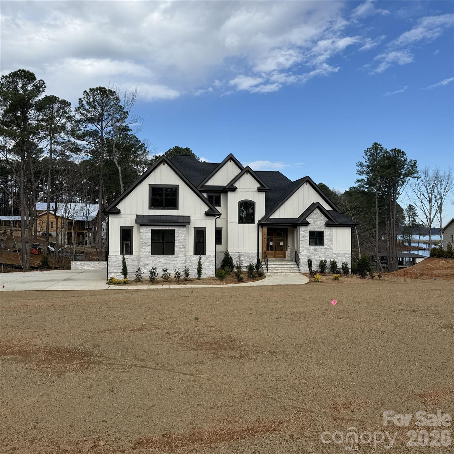 PROPOSED BUILD! Welcome to the opportunity to build your dream waterfront home in the beautiful Lakeside Reserve community! This stunning home plan offers the perfect blend of luxury, comfort, and functionality, featuring beautiful finishes throughout. The main level boasts a spacious primary suite with a stunning ensuite bathroom, along with a thoughtfully designed kitchen featuring a scullery for additional prep space and storage. Upstairs, you'll find two additional bedrooms, two full bathrooms, and a versatile bonus room that could also be converted into a fourth bedroom! Situated on an incredible waterfront lot, this home will offer breathtaking main channel views and the opportunity to enjoy lakefront living at its finest! With over 100 feet of waterfrontage, this beautiful lot meets the minimum shoreline frontage requirement for a private dock! Buyers should verify dock eligibility and obtain any necessary approvals and permits through Duke Energy Lake Services. Lakeside Reserve offers an impressive lineup of amenities, including a community pool, outdoor kitchen and gathering area, pickleball courts, a relaxing cabana lounge, community lake access, walking trails, and boat / RV storage. Don't miss this incredible opportunity to build your dream home on a beautiful waterfront lot in Lakeside Reserve!All photos are examples of this home plan previously built at another location. Home is a proposed build, and finishes, features, and specifications are subject to change.