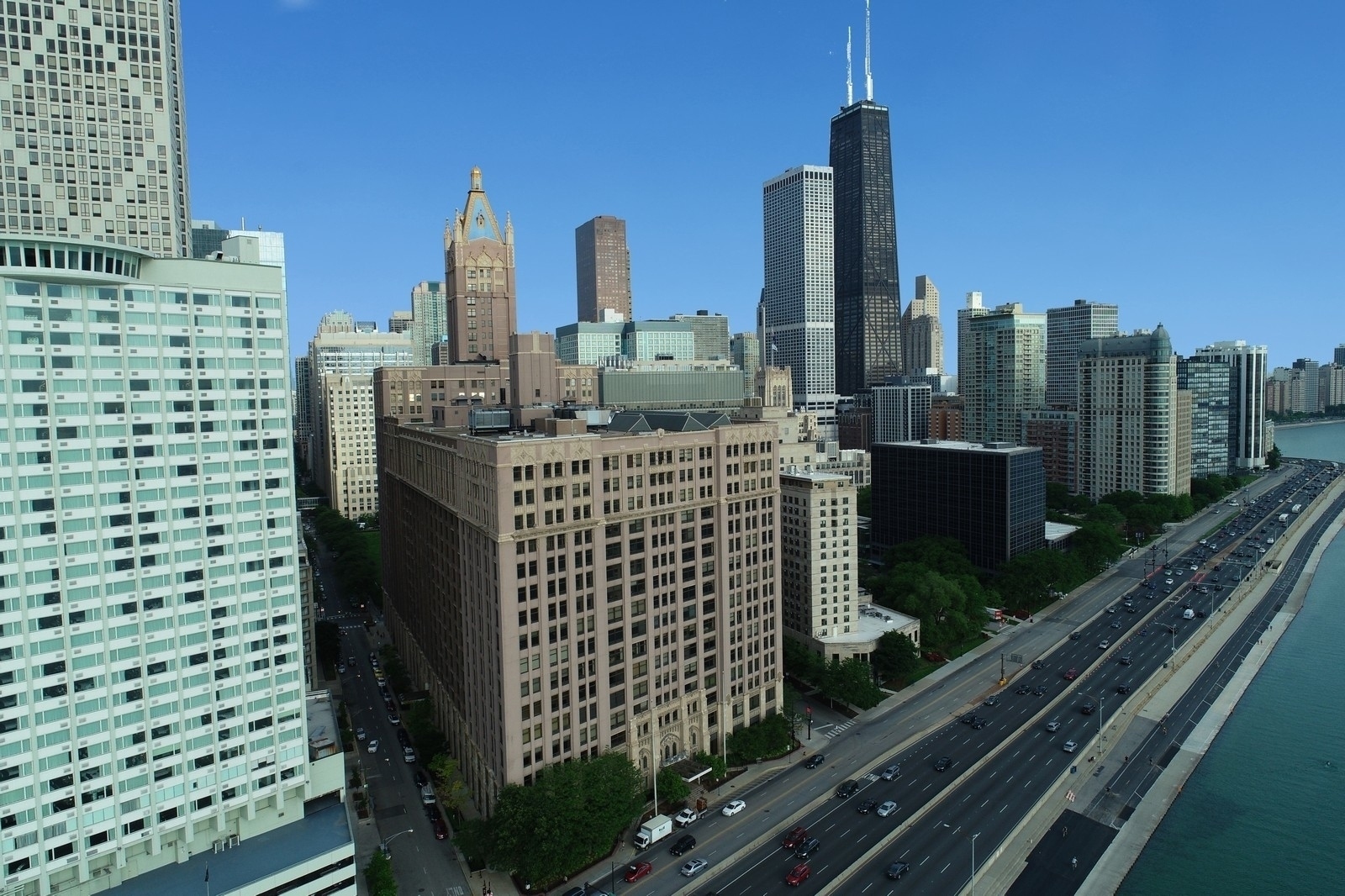 NEARLY 3000SQFT OF IMMACULATELY AND RECENTLY TOTALLY RENOVATED & PROF DESIGNED SPACE WITH SWEEPING PARK & CITY VIEWS AWAITS INSIDE ONE OF THE MOST PRESTIGIOUS & HISTORIC HIGH-AMENITY BUILDINGS IN ALL OF CHICAGO! STEPS TO THE LAKE & OAK STREET BEACH, THIS 3-4+BDRM/2.1BA LIGHT-FLOODED, PARK-FACING CORNER HOME LIVES LIKE A SFH AND IS PERFECT FOR COMFORTABLE LIVING & ENTERTAINING. PROF GRADE EAT-IN CHEF'S KITCHEN OPENS TO MASSIVE DINING ROOM & INCREDIBLY BRIGHT LIVING ROOM;SPLIT FLOOR PLAN WITH PRIMARY SUITE ON OPPOSITE SIDE OF OTHER BEDROOMS & LIVING SPACE SEPARATED FROM LIVING SPACE;ZEN-INSPIRED BATHS & PROF ORGANIZED CLOSETS T/O;24/7 DOOR STAFF, SPA-CALIBER NEWLY RENOVATED INDOOR POOL & EXERCISE FACILITIES & PROXIMITY TO WORLD-CLASS SHOPPING & DINING MAKE THIS THE PERFECT PRIMARY RESIDENCE OR 2ND HOME! PARKING & ADD'L STORAGE AVAIL IN BUILDING!
