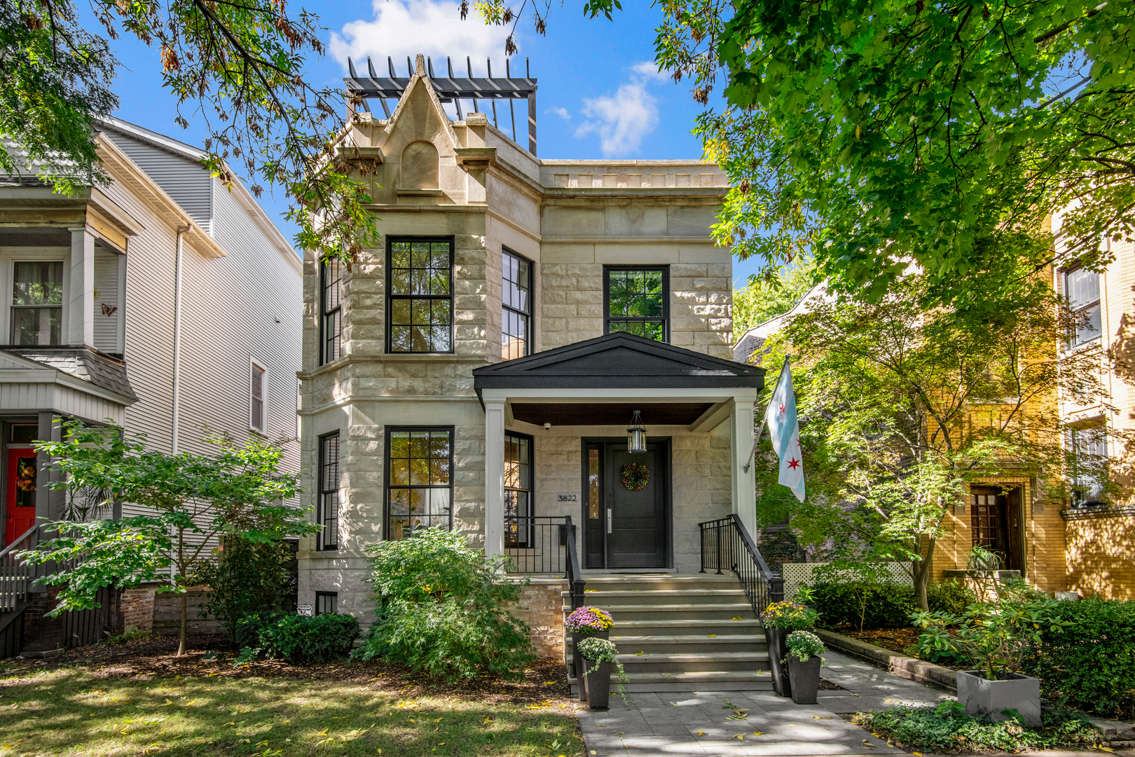 Impressive extra-wide greystone beautifully renovated on a coveted 35' lot in the heart of North Center. This immaculate 6BR/4 full + 2 half BA home boasts gorgeous curb appeal, an expansive spacious floorplan with 4 bedrooms upstairs, quality custom finishes, amazing outdoor spaces with a back patio as well as rare rooftop deck, and a 3 car garage! Main level features a gracious foyer, formal living room and dining room with rich hardwood oak flooring, gas fireplace, wet bar with wine fridge, tucked away powder room, huge eat-in chef's kitchen with beautiful natural stone countertops, commercial grade appliances including a 60" Wolf range with double ovens, 48" Subzero, built-in desk station, a generously sized family room with gas fireplace and built ins, and a mudroom leading to a lovely porch and patio with an outdoor fireplace. 2nd level features 4 bedrooms, 3 bathrooms, and a large laundry room. The 4th bedroom is currently used as a home office with built in desk. The vast primary suite boasts two walk-in closets and a spa like marble bathroom with heated flooring, rain shower and separate soaking tub. Lower level features radiant heated flooring, spacious family room with wet bar and beverage center, guest bedroom, 1.5 bathrooms, exercise room, 500 bottle temperature controlled wine cellar, and abundant storage. Incredible rooftop deck with high end wood decking by Thermory, pergola over outdoor dining area, and expansive lounge area perfect for entertaining. Wonderful walkable location close to brown line, Trader Joe's, and all of the best North Center has to offer yet tucked away on charming tree lined Hoyne Avenue.