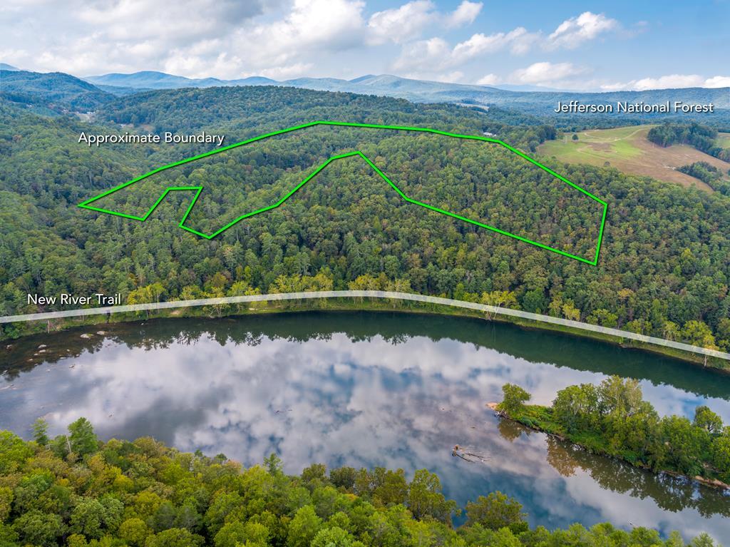 Rare 18.96-Acre Unrestricted Property Overlooking the New River in Fries, VA This exceptional 18.96-acre tract offers a rare opportunity to own unrestricted land with breathtaking views of the New River in Fries, Virginia. Perfect for a horse property or private retreat, this land provides endless possibilities for outdoor enthusiasts and nature lovers alike. Ride the scenic New River Trail, enjoy fishing, kayaking, hiking, or biking, and take in the charm of the nearby town of Fries—all just minutes away. Located less than one mile from the Jefferson National Forest, the property is also ideal for hunting, with abundant wildlife at your doorstep. Whether you're envisioning a private mountain getaway, a mini-farm, or a dream home with commanding river views, this property offers an incredible building site with privacy, seclusion, and easy access to outdoor adventure. Don't miss this unique chance to own a slice of the Blue Ridge with unlimited potential. Additional acreage is also available.