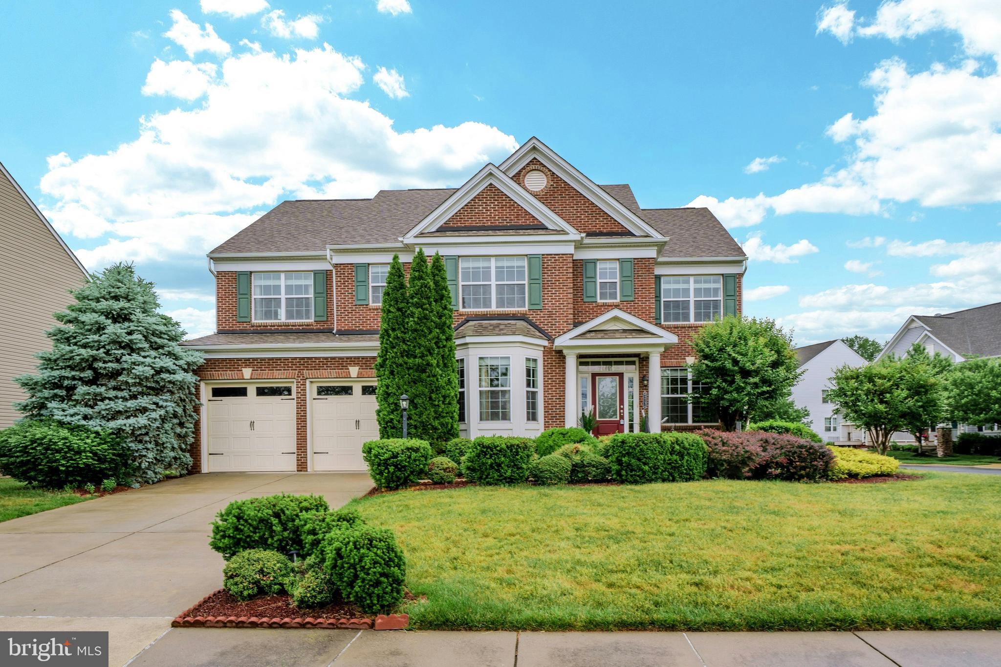 Welcome home to this stunning former model home built by Beazer Homes featuring 5 bedrooms, 4.5 baths & over 4,800 square feet of well-appointed living space conveniently located in the highly sought after Brambleton community! This home features custom paint, upgraded lighting, upgraded flooring, detailed moldings & other custom finishes throughout. The covered entry greets you as you enter this stately colonial. Private main level office with custom built-ins provides an incredible work from home space. Elegant living room & formal dining rooms both feature bay window bump-outs. Chef's kitchen with tons of cabinetry, stainless steel appliances, center island with breakfast bar, gas cooking, under cabinet lighting & large eating area. The expansive great room features gas fireplace with stone surround & leads into the light & bright sunroom with vaulted ceiling. The main level features a private powder room as well. The oak staircase with carpet runner & iron ballusters leads you to the upper level. Large primary suite with sitting area,two walk-in closets & spa inspired bath with soaking tub & separate shower. The second and third bedrooms shared an upgraded bathroom. Fourth bedroom with private ensuite bath & laundry room with built-in cabinetry completes the upper level. Finished walk-up lower level with huge recreation room ideal for entertaining, 5th bedroom/media room with walk-in closet, 4th full bath & storage. The low maintenance deck with pergola leads to the large custom patio all overlooking the fenced rear yard. Mature landscaping surrounds the property including apple trees! Additional upgrades include hot water heater (2024), washer & dryer (2022), whole house water filtration, radon mitigation system, home security system & more. Sought after school pyramid of Madison's Trust - Waston Mountain/Brambleton Middle School - Independence High school. The amenity rich Brambleton community offers pools, walking paths, fitness center, basketball courts, playgrounds, year-round events & more. High speed internet is included in your monthly HOA fee as well. This incredible location within the community offers convenience to Hanson Park, Brambleton Town Center with shopping & dining, nearby schools & commuter routes.