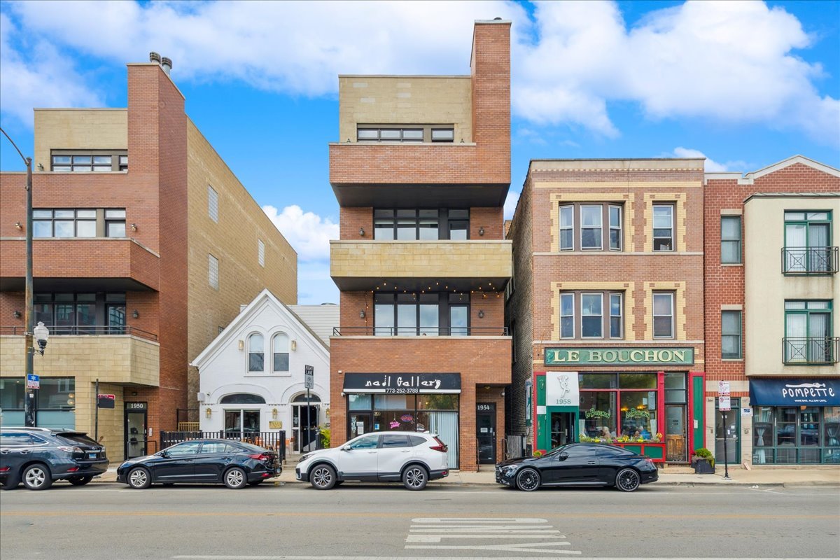 In the heart of Bucktown, this thoughtfully updated and meticulously maintained extra-wide two bedroom, two bathroom condo offers the perfect blend of style, comfort, and location. The home welcomes you with an expansive and light-filled layout, where oversized windows pour in sunlight and a rejuvenated gas fireplace creates a warm centerpiece for the living space. Just beyond, a private walk-out terrace runs the full width of the home, an ideal extension for grilling, entertaining, or simply enjoying the fresh air.  The beautifully renovated kitchen is both functional and stunning, with crisp white cabinetry, quartz countertops, a massive island with seating, a new beverage fridge, and top-of-the-line appliances. Rather than a traditional dining area, the owners created a custom bar that makes entertaining effortless and gives the home a truly unique personality.  The primary suite is a serene retreat, offering a newly built walk in closet with full wall custom storage and a spa like bathroom featuring dual sinks, quartz counters, a soaking tub, and a separate glass shower. The second bedroom provides flexibility as a second bedroom or home office, and is complemented by another fully renovated bathroom that mirrors the home's elevated design.  A second private outdoor escape awaits on the expansive west facing deck at the rear of the home, where natural light lingers into the evening and the setting is perfect for unwinding or hosting friends. With two parking spaces one garage and one exterior and every modern update imaginable, including a refreshed fireplace, new custom refrigerator, washer and dryer, LED lighting, and fresh paint throughout, the home is completely turnkey.   Best of all, the location could not be more ideal. Just steps from Bucktown and Wicker Park's renowned dining, shopping, nightlife, and the 606 Trail, with effortless access to 90/94, this condo captures the essence of city living in one of Chicago's most desirable neighborhoods.