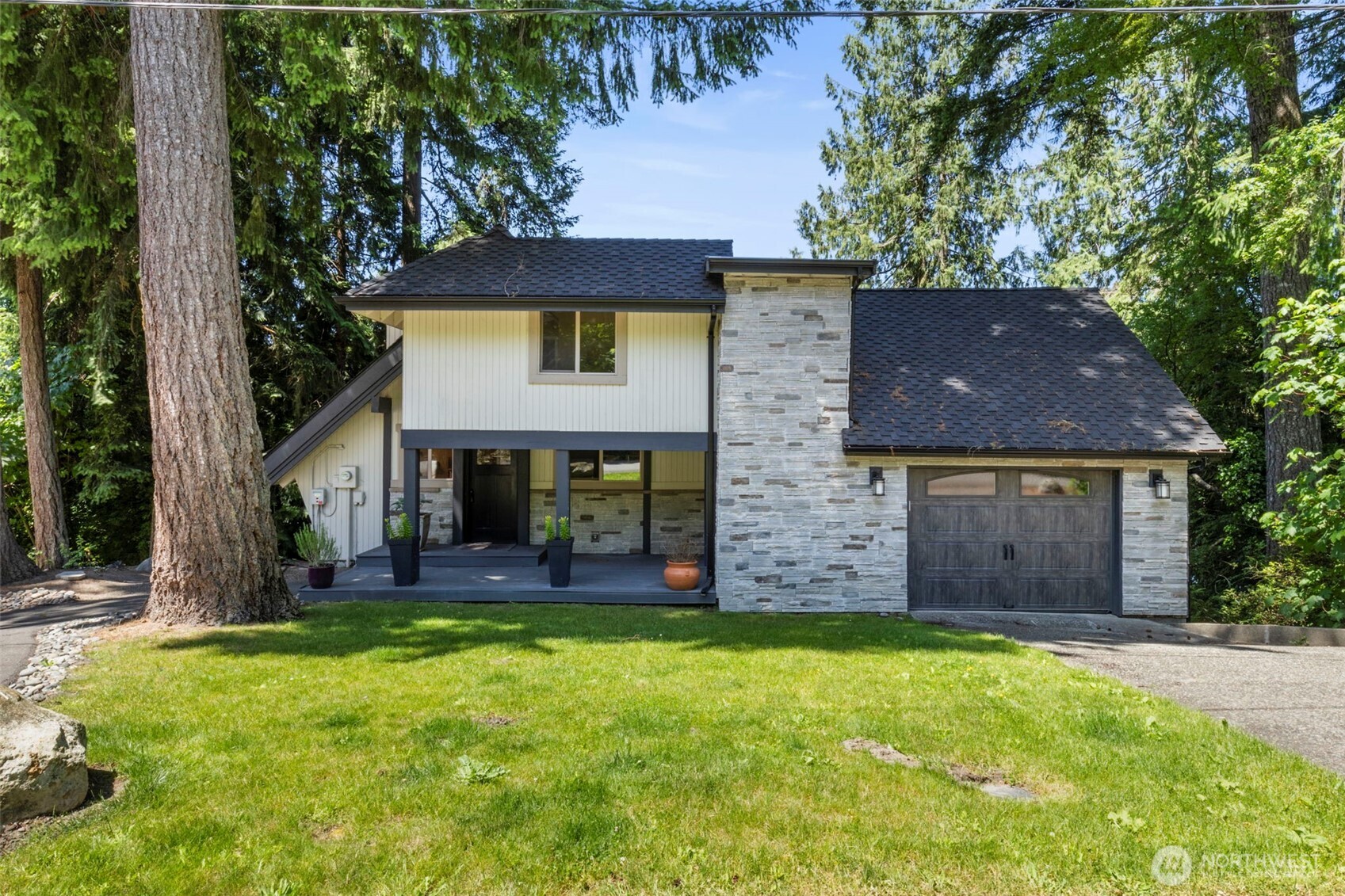 Stunning Chalet-Style waterfront home in Poulsbo’s Island Lake community featuring 3 beds and 3 baths. Enjoy two private suites—one upstairs with lake views, office, and bath; one downstairs with private balcony and hot tub. Gourmet kitchen boasts 40" Pro-line gas range, Thermador fridge/freezer, wine fridge, and more. Set on a spacious, private lot (A total of 4 tax parcels) with breathtaking lake views. Relax in the hot tub, entertain in the backyard, Go for a swim, Take you SUP board or Kayak out for an evening/morning paddle, or explore nearby Island Lake park. Includes 1-car garage and side parking for a small boat or trailer. Comfort, quality, and serene lakefront living await less than 10 min from Silverdale and the new Hospital, & Bangor Base.