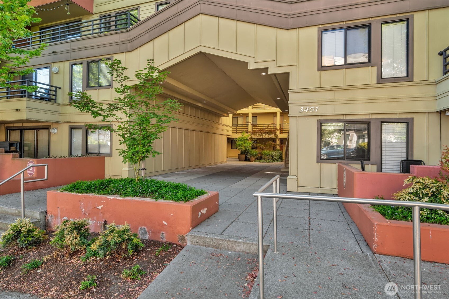 Updated 2-bedroom condo in heart of desirable Wallingford neighborhood. Excellent location just moments from Lake Union, Gas Works Park, the Burke-Gilman Trail, shops, cafés, and restaurants—with easy access to UW, Fremont and Downtown Seattle. Enjoy morning coffee on your private balcony. In the evening, head up to the shared rooftop deck and take in stunning views of Lake Union, Olympic Mountains, Seattle downtown. Inside, the 2BD/1BA layout feels fresh and inviting with new paint, new carpet, and an updated kitchen featuring stainless-steel appliances. The open living room with oversized floor-to-ceiling windows fills the space with natural light. One reserved, covered parking space in the common garage. Secure lobby entrance and elevator provide no-step access to the unit. HOA dues cover water, sewer, and garbage. Dogs and cats friendly, no rental cap—a fantastic opportunity in a prime Seattle neighborhood.