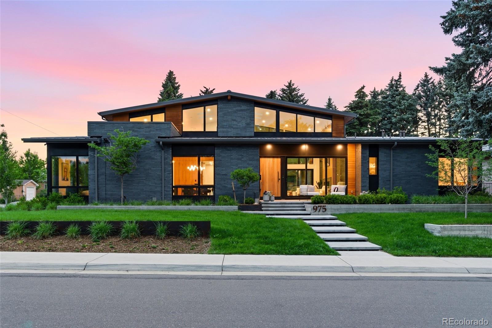 Available to the public for the first time in one of Belcaro's most sought-after pockets, Soleil on South Monroe is a custom midcentury modern residence where soaring ceilings, warm materials, and an abundance of natural light create a home that feels both elevated and deeply livable. Enter into The Great Room, the beginning of a thoughtful open floor plan. The chef's kitchen boasts two islands, Wolf and Subzero appliances, a generous pantry and hidden prep space. A grand dining room and home office wrapped in floor to ceiling walnut wood round out this large midcentury modern space. The main-floor primary suite includes an oversized walk in closet and spa-like bathroom with steam shower and soaking tub. Two additional ensuite bedrooms accompany the primary on the main floor. Upstairs, an open loft with an additional bath offers sweeping views, perfectly scaled for grand entertaining and quiet retreat alike. Downstairs, the expansive basement includes two additional ensuite bedrooms, a second laundry room, gym and sauna. At almost a third of an acre, the corner lot delivers a resort-caliber offering complete with a 3-car garage, outdoor kitchen, hot tub, sports deck, and heated pool to enjoy year-round. The spectacular architecture throughout differentiates a property that, in a neighborhood where exceptional homes rarely come available, is one to experience in person.