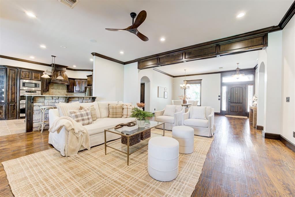 NEW PHOTOS! Stunning 4 bed, 3 full + 2 half bath home with a pool in The Willows combines comfort, function, and luxury. Main living features an open layout with cozy fireplace, updated lighting, and seamless flow into the chef’s kitchen—equipped with GE Profile appliances, refrigerator, double ovens, gas cooktop, center island, breakfast bar, and built-in hutch. A private study with fireplace offers a warm, functional workspace. The primary suite is a true retreat with bay windows, patio access, unique ceiling detail, spa-like bath, and oversized walk-in closet with custom built-ins. Secondary bedrooms include en-suite and Jack-and-Jill options, all with wood flooring and upgraded finishes. Upstairs enjoy a fully outfitted theatre room, large bonus room, and dual walk-in attic access. Outdoor living shines with a covered patio, mounted TV, grill, and pool with hot tub, slide, water feature, gazebo, and patio furniture. Recent updates: new roof, gutters, cedar privacy fence, and fresh interior/exterior paint. Extras include mud bench, central vac, sprinkler system, storm shelter, oversized 3-car garage, plus all TVs, kitchen refrigerator, barstools, and patio furniture. Gated community with ponds, trails, and easy I-35 access. Moore Schools. Schedule your showing today!