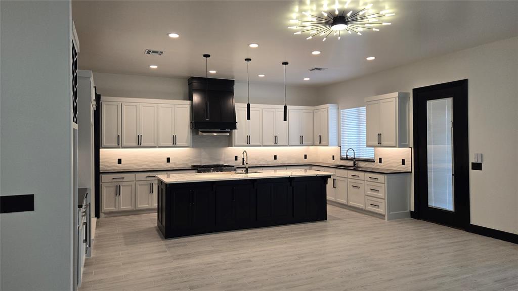 This exceptional upscale modern design new home offers a blend of luxury and functionality, featuring: Custom Cabinets: Tailored cabinetry that enhances both style and storage along with a study. Forno Appliances: Equipped with Forno's Italian-inspired, professional-grade appliances, the kitchen. Ice maker to make entraining much easier. Space-Saver Microwave: A built-in microwave designed. '60 Refrigerator and the tall Beverage Refrigerator and Marble Countertops with Backsplash: High-quality stone countertops complemented by a matching backsplash, offering durability and timeless beauty. Garage Door Opener with Keypad: An automated garage door system featuring a convenient keypad entry. 2" Blinds on All Windows (Excluding Obscured Glass) High-Efficiency 16 SEER Central Air-Conditioning: A 16 SEER central air-conditioning system that provides superior comfort and energy efficiency, ensuring a cool and comfortable living environment. Fully Sodded Yard: A professionally landscaped yard with lush sod, creating an inviting outdoor space ready for enjoyment. Along with covered patio so you can enjoy mornings or evenings comfortability including the gas stub. Retractable Backdoor: A retractable backdoor that seamlessly connects indoor and outdoor living areas, perfect for entertaining and enjoying the outdoors. Electric Fireplace: A modern electric fireplace that adds warmth and ambiance to the living space without the maintenance of traditional wood-burning options. Exhaust Vent to the Exterior: An exhaust system that directs air outside, maintaining indoor air quality and comfort. This home is thoughtfully designed to offer a harmonious blend of luxury, functionality, and modern living. Home is waiting for the 1st Owner so you can pick the carpet/flooring for the bedrooms and study. Home is just minutes of I-35 or going East to I-240. Community has a pool and recreational center.  **Tax Amount on land only**