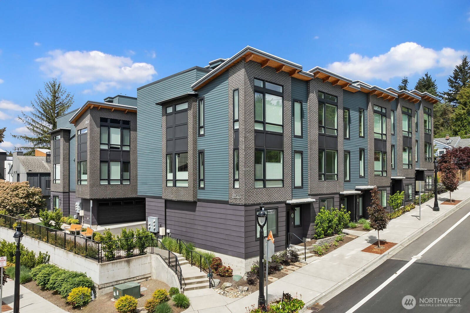 Welcome to your urban oasis in the heart of downtown Bothell!  This three bedroom townhome has the perfect blend of modern elegance and city convenience.  The main floor boasts high ceilings with an open floor plan leading to the kitchen with quartz slab counters, stainless steel appliances, and plenty of cabinet space!  At the end of the day, retire to your primary suite with spa like ensuite bath.  Not only that, two more bedrooms, two full baths, air conditioning, and a large two car garage meet your every need!  Just when you think it can't get any better, a massive rooftop deck to entertain everyone!  Enjoy a life right in the middle of it all - shopping, restaurants, parks, top rated schools and the library. Have it all!
