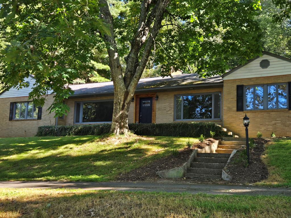 Location, custom features, recent updates, and privacy - this home has it all! This home features a remodeled kitchen with new appliances, new cabinets with granite countertops, accessible from the mudroom/laundry room. The dinning room is a stunner with built-in cabinets and plenty of room for large family gatherings. There is also a butlers pantry just off the dining room area. The living room has amazing natural light, hardwood flooring, and a custom-made entertainment center. The three bedrooms are of ample size and all have built-in shelving, drawers, and plenty of closet space. There are 2.5 bathrooms and a partially finished basement. The basement has finished portions and would be a great den or family game room. This impressive 2,600 sq ft house sits on a 2-acre lot with lots of privacy in the terraced backyard. Schedule a showing today because this one won't be on the market long!
