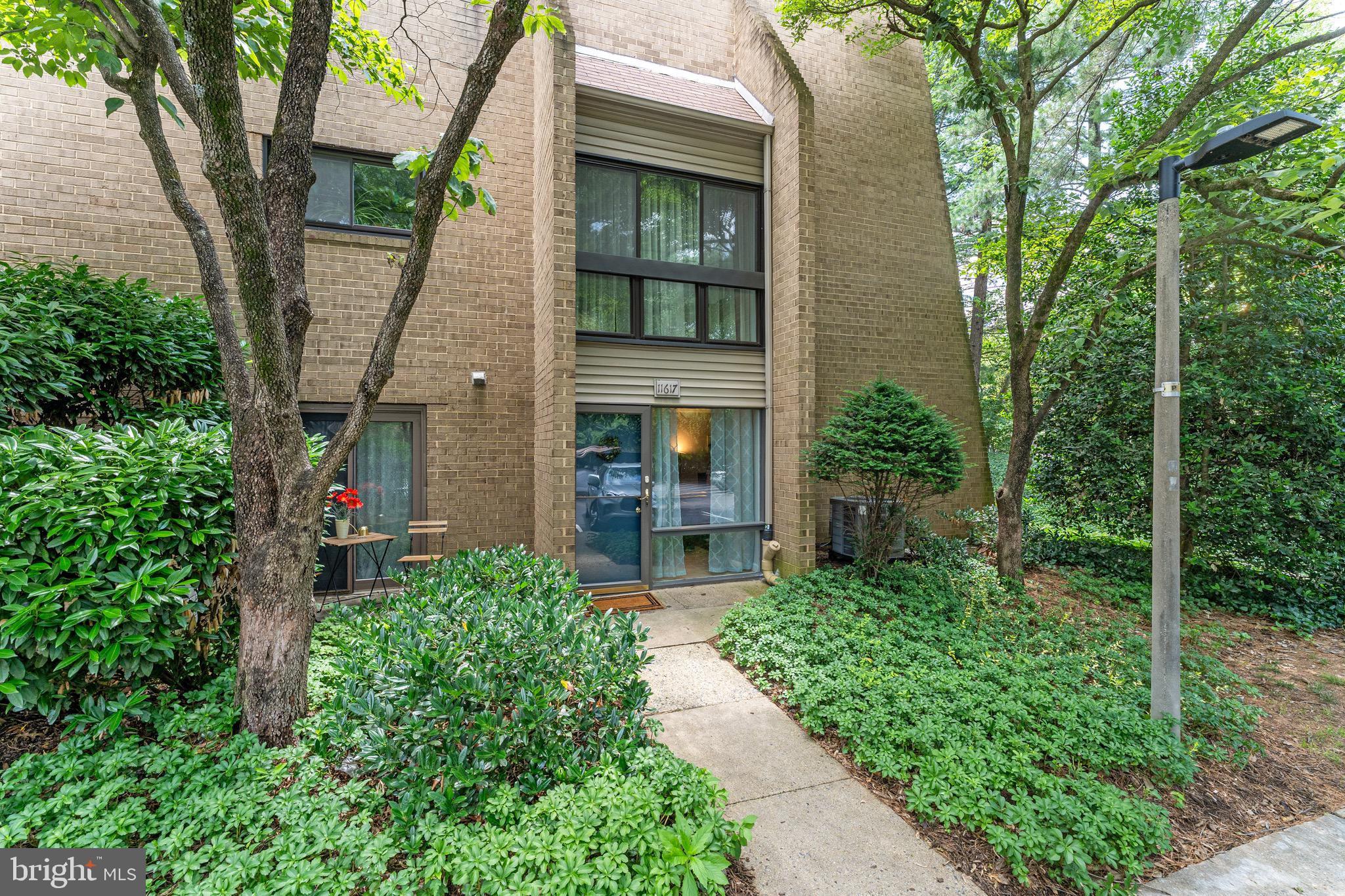 Welcome home to this bright and spacious 2-bedroom, 2-bath condominium nestled in a peaceful, park-like setting in the heart of Reston. Offering a desirable private side entrance, this inviting home features an open and airy layout with abundant storage, including multiple oversized closets throughout. Freshly painted. The sun-filled living and dining areas showcase beautiful flooring and provide seamless access to a private patio overlooking mature trees and green space—perfect for relaxing or entertaining. The eat-in kitchen offers granite countertops, maple cabinetry, ceramic tile flooring, and direct access to a second outdoor patio for enjoying your morning coffee. Ideally located just minutes from the Reston Metro, major commuter routes, shopping, dining, and everyday conveniences. Residents enjoy access to Reston’s exceptional amenities, including scenic lakes, walking trails, tennis courts, swimming pools, and golf courses.