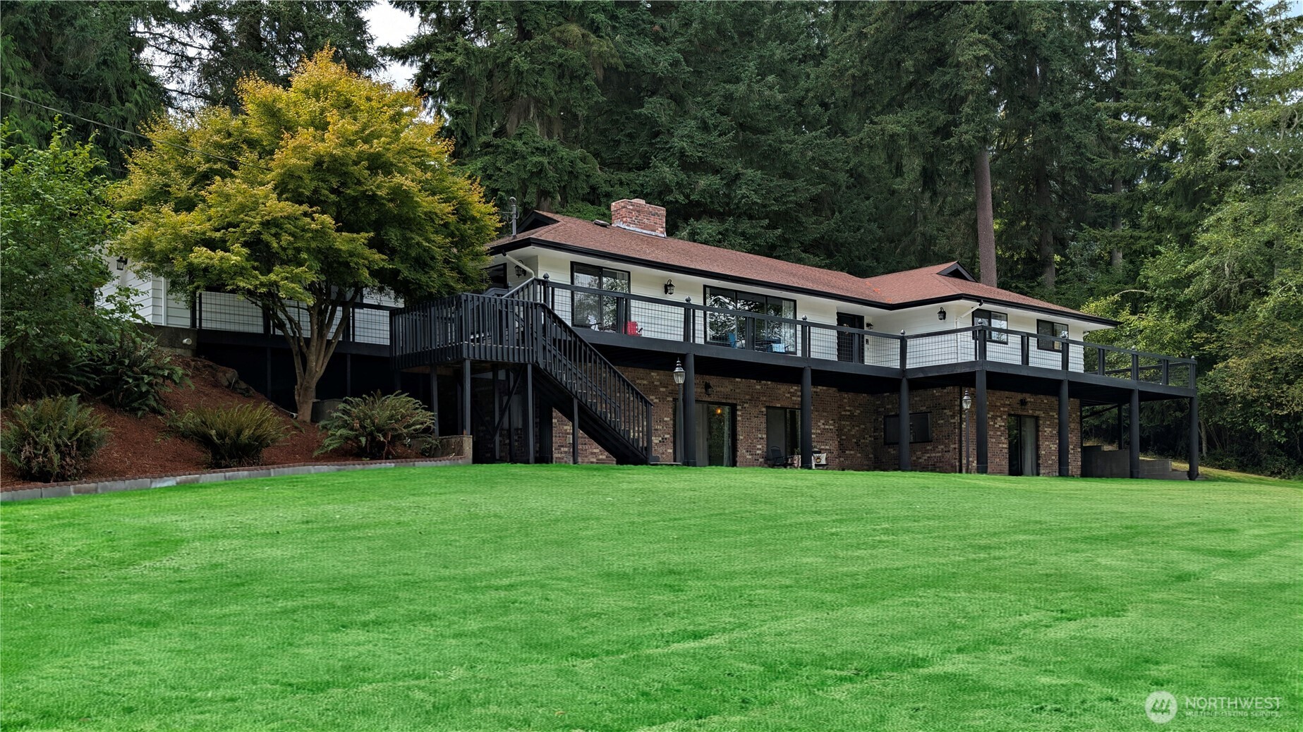 A bit of legacy in the middle of the PNW. Drive up to a fully renovated 5,000 + sf multi generational home with just under 3,000 sf on the main floor. This 1.2 fully developed acres offers space for everyone with multiple outdoor living spaces & in ground sprinkler system. Main living unit includes 3 oversized guest rooms, primary with ensuite & private access. 2 living rooms, office, formal dinning & double bar kitchen between coffee corner & great room for a seamless transition between every day & life's big celebrations. Designed with fresh flooring throughout, quartz counters, designer fixtures, & in wall vacuum. End the night in your private PNW oasis with shed, dinning & living as well as a wraparound deck for all seasons of the PNW. But all of this without mention of the secondary living space. Another 2400 sf with eat in kitchen, an abundance of living space full of natural light, XL bedroom & home gym. The oversized patio off this second unit leaves nothing to be desired. But if it's workspace you're looking for, it can be found in the oversized fully insulated and epoxied deep garage or just off the NW side of the house. Just a jaunt to both Mountain and Ocean life and a short train ride to both Portland and Seattle. This estate is located conveniently near the hospital & I5 access and just steps from the most charming downtown in Washington.  A home for everyone because life comes in a variety of sizes and stories. Come tell yours here.