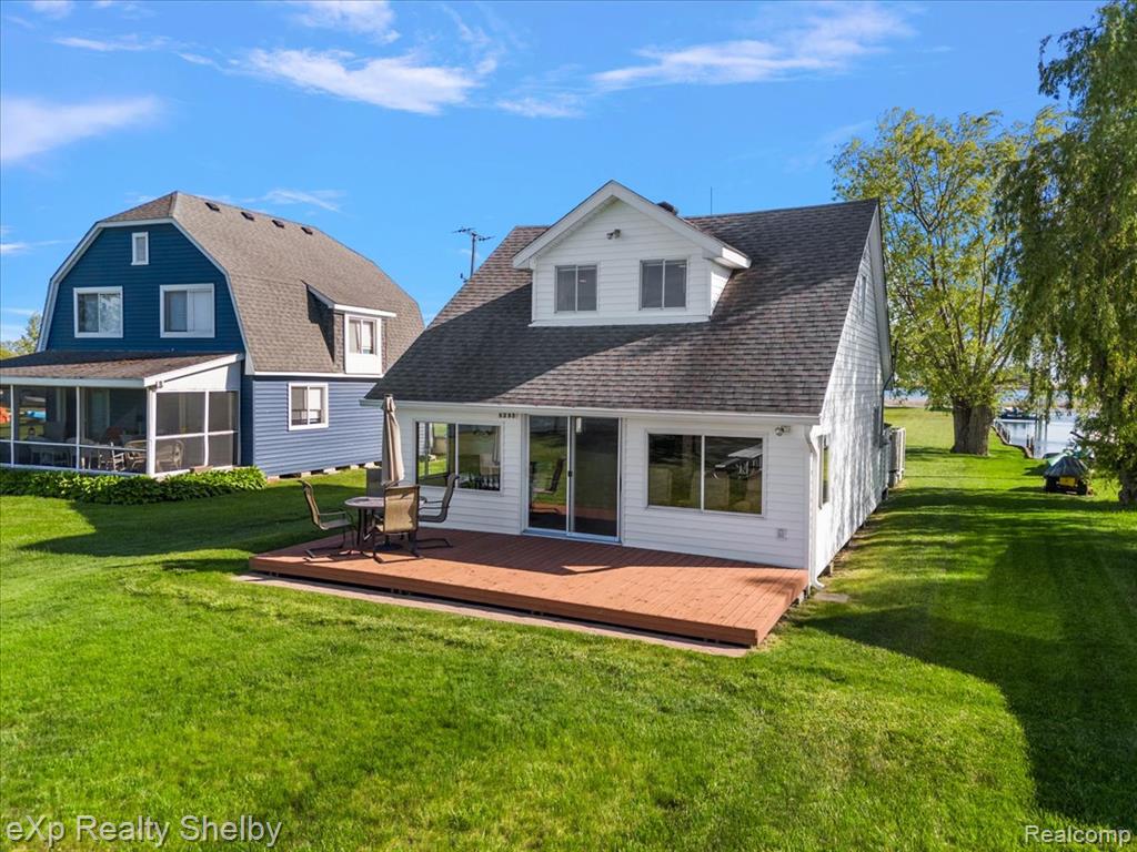 Hop in your boat and check out this must see property. Words cannot describe the incredible views. It is a one-of-a-kind island cottage.  Nestled on an island in the St. Clair Flats (also known as the North Channel Flats), just upstream from the entrance to Anchor Bay of Lake St.Clair. This two-story retreat offers unmatched panoramic views of wildlife, water, sunrise and sunset skies. Accessible only by boat but just a short three minute boat ride from the mainland rented boat well / car parking lot.  This property delivers a peaceful, adventure-filled lifestyle that’s perfect for fishing, hunting, boating, or simply unwinding in nature.Enjoy an open floor plan, enclosed front porch, front and rear decks, and a 300+ ft seawall offering exceptional dockage around the island. The property includes a 40’x16’ covered boat hoist with a 16,000 lb lift capacity (fits up to a 12’ beam) and a 12’x10’ utility/storage shed — ideal for lake life convenience. Located across from Decker’s Landing and Belfour’s Gas Dock, and downstream from Harsens Island.  Approximate boat ride times from the island cottage, 5 minutes to Bare Naked Bay, 15 minutes to Cabana Blue Grill, 15 minutes to Browns Bar,  25 minutes to Muscamoot Bay, 25 minutes to Algonac Harbor Club.A true boater’s and sportsman’s paradise with endless potential, including use as a vacation rental. This cottage is turnkey ready. Owner open to selling fully furnished—ready to enjoy your own island hideaway!