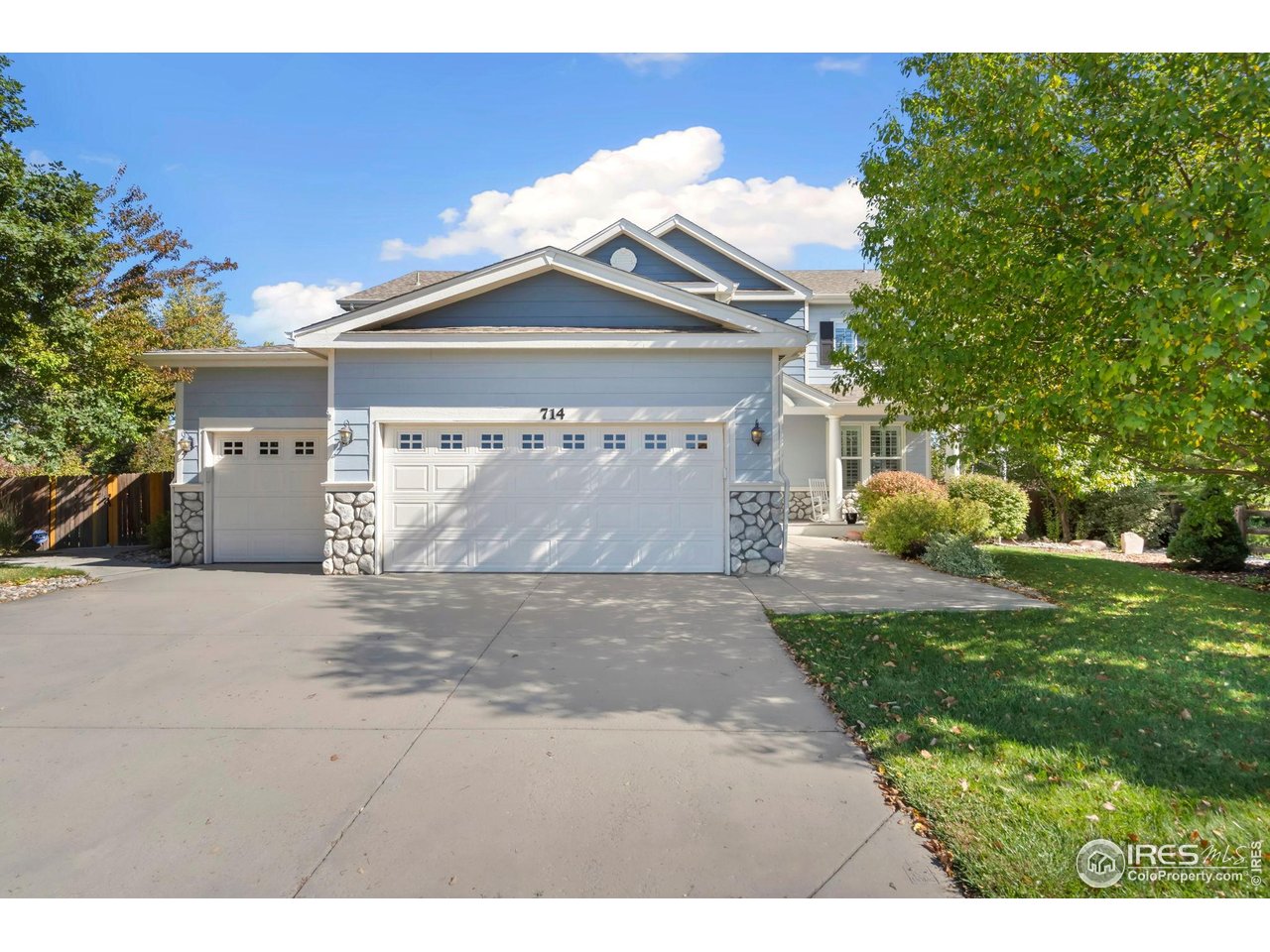 Welcome home to this light-filled home that opens with soaring ceilings and abundant natural light, creating an inviting and spacious feel from the moment you step inside. Thoughtfully updated finishes and plantation shutters throughout add timeless style and comfort. Set on a large lot directly across from an expansive private park, the home also offers mountain views from the front porch-perfect for morning coffee or evening sunsets. Outdoor living shines here with a beautifully designed backyard featuring mature landscaping, a newer deck, paver patio, tranquil water feature, and a cozy fire pit ideal for gatherings or quiet relaxation. Inside, the eat-in kitchen is well equipped with double ovens and a gas range, complemented by a separate dining room for more formal occasions. The flexible floor plan includes large bedrooms, a living room, family room, and a generous upstairs loft, providing multiple options for work, play, or entertaining. A private main-floor office with a double-sided fireplace offers the perfect work-from-home retreat. Completing the home is a full unfinished basement, ideal for storage or future expansion. This property seamlessly blends indoor comfort with exceptional outdoor spaces in a truly special setting.