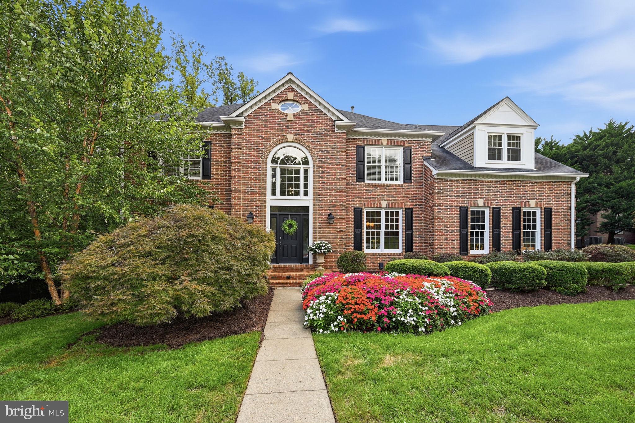 This is a truly exceptional home, filled with the quality, craftsmanship and extra details you expect in a home at this level. Beautiful hardwood floors run throughout, the rooms are spacious and comfortable, and the home sits on an incredibly private, level homesite surrounded by mature landscaping at the end of a quiet cul de sac.The main level is designed for the way you actually live. The formal living room is warm and inviting with its own gas fireplace, creating a comfortable place to entertain, sit with friends or settle in with a good book. Across the home, the family room makes an entirely different statement with a soaring two story ceiling, walls of windows and a dramatic floor to ceiling stone wood burning fireplace. A private office with bay windows, formal dining room, powder room and laundry room round out the main level.At the center of it all is a fantastic designer kitchen. A huge island provides plenty of room to gather, surrounded by custom cabinetry, granite countertops, Viking appliances and Sub Zero refrigeration. Additional touches include filtered and instant hot water, a sensor faucet and a spacious breakfast area filled with natural light.Just outside, the large deck becomes an extension of the living space. It overlooks a completely level backyard surrounded by mature landscaping and trees, giving you a level of privacy that is increasingly hard to find. There is plenty of room to entertain, relax or enjoy a fire in the wood burning chimney on a cool evening. A covered patio below provides another outdoor living area with direct access from the walkout lower level.With 6 bedrooms, 5 full baths and 2 half baths, there is no shortage of space. The primary suite includes a separate sitting area, two dressing areas, generous closets and storage, and a marble bath with a large shower and separate water closets. Three additional bedrooms and two full baths are also upstairs, including a Jack and Jill bath.The walkout lower level feels like a true continuation of the home rather than an afterthought. There are two additional bedrooms, two full baths, a large recreation room with a gas fireplace, fitness space, a half bath, cedar wine cellar and substantial storage. It is an ideal setup for guests, extended family, entertaining or simply having room for everyone to spread out.A side load two car garage adds to the classic exterior and keeps the front elevation clean. The mature landscaping and private setting make the property feel removed from the activity around it, yet Reston Town Center is approximately 2 miles away. Dulles International Airport, Metro, restaurants, shopping, lakes, trails, pools and tennis are all within easy reach.This is a home that delivers on the details, but what really stands out is how comfortable it feels. Impressive when you want it to be, private when you need it to be, and designed with spaces you will actually use.