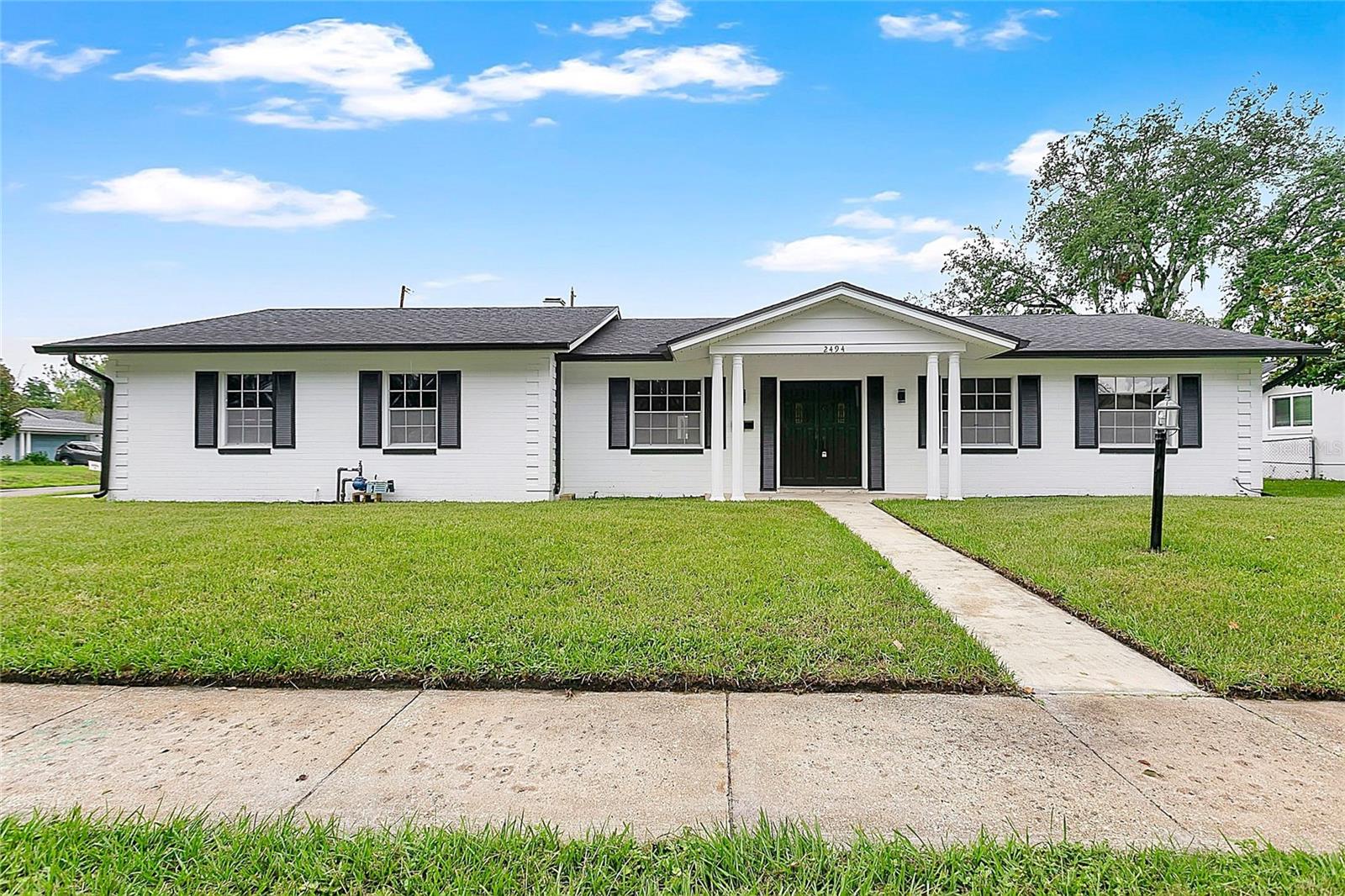 Welcome to 2494 Castlewood Road, a beautifully updated pool home situated on a spacious corner lot in one of Maitland's most established neighborhoods. This move-in-ready residence offers peace of mind with a newer roof, solar panels, updated HVAC, and extensive interior renovations throughout.Inside, you'll find an open and inviting floor plan featuring luxury vinyl flooring, updated bathrooms, modern fixtures, quartz countertops, and custom cabinetry. The spacious primary suite includes a walk-in closet and renovated en-suite bath, while the additional bedrooms provide flexibility for family, guests, or a home office.A large screened Florida room overlooks the backyard and creates the perfect space for year-round entertaining. Outside, enjoy the oversized swimming pool, expansive patio deck, fully fenced yard, and storage shed, offering plenty of room for recreation and outdoor living.Conveniently located just minutes from Downtown Maitland, Winter Park, Park Avenue, AdventHealth, shopping, dining, and major roadways including I-4, this home combines modern updates, energy-efficient features, and an exceptional location in the heart of Central Florida.