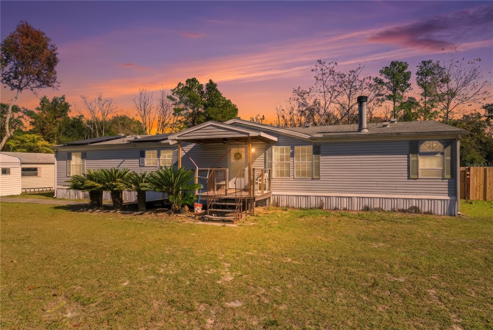 Welcome to this generously sized 3-bedroom, 2-bath home offering 1,809 square feet of living space on a beautiful half-acre lot. A detached two-car garage with an attached workshop provides excellent space for hobbies, storage, or projects. This property features a private pool and hot tub, creating a wonderful setting for relaxing weekends and outdoor gatherings.Inside, you’ll find a functional layout with multiple living areas, a large kitchen footprint, and plenty of natural light. The home offers a great opportunity for a buyer to make it their own with cosmetic updates and personal touches. This property is ideal for those seeking space, privacy, and long-term potential. A rare chance to enjoy a large lot with resort-style amenities at an accessible price point. Solar panels are Paid off