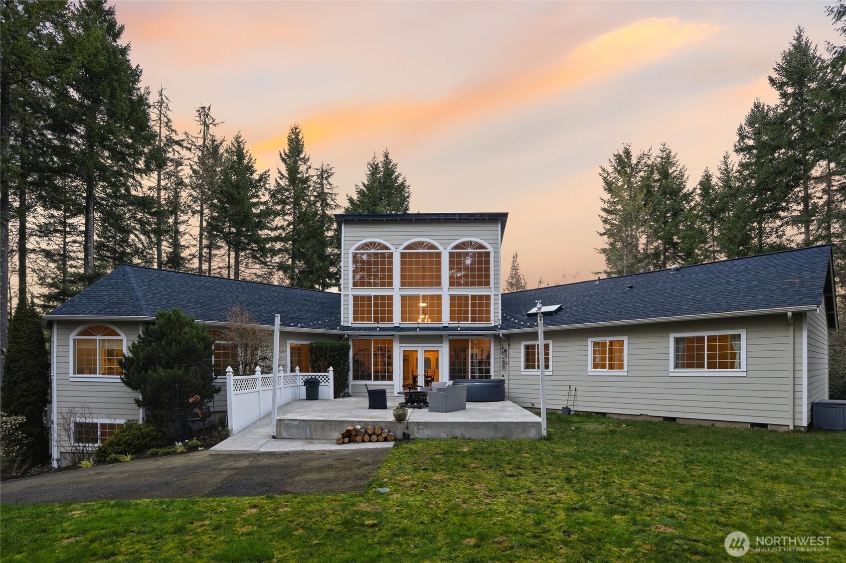 Stunning Seabeck NW style home on spacious 5.7 acres! Private and secluded! Spacious living with 3,965 sq ft. Detached 1,320 sf garage built in 2016! Attached 3 car garage! New 70,000 roof with transferrable warranty. Impressive open floor plan. Amazing solarium/atrium with two story ceiling with french doors to large outdoor patio! Perfect for entertaining! Custom kitchen with quartz countertops with gas range stove top, large breakfast bar, two skylights, newer furnace and heat pump, LVP and tile flooring. Adjacent family room with cozy pellet stove! Main floor living with 3 bedrooms and office. Five piece Master bath with large soaking tub overlooking beautiful territorial view! Dual vanity with granite counters, walk-in closet, walk-in tiled shower with multiple shower heads!