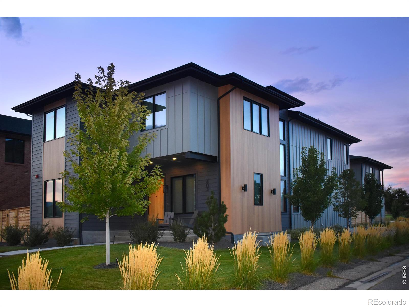 Welcome to this stunning custom home offering walkable convenience and refined living, complete with a finished basement and fully independent ADU. Move-in ready with designer blinds and mature landscaping. Step out the back door to Whole Foods, Super Target, the McCaslin RTD station, and the newly rebuilt Founder's Park. From the front, enjoy Downtown Superior and miles of open space trails. Located on a corner lot, the home features an open floor plan, seamless indoor-outdoor living, and mountain views. Generous rooms, sweeping windows, and 10-foot ceilings throughout fill the home with natural light. The main level includes rich wood flooring, a great room with fireplace, and a chef's kitchen that includes a large island and striking countertops. Between the home and garage, a secluded landscaped courtyard patio with privacy fencing creates a blissful outdoor retreat. A custom floating staircase leads to two spacious upstairs bedrooms that are in addition to the primary suite---each with its own bath, plus a laundry room and sitting area opening to a covered balcony. The primary suite offers a five-piece bath with soaking tub, Porcelanosa-tiled walk-in shower, and expansive walk-in closet. A main-level ensuite bedroom provides flexible living and use options. The finished basement adds a rec room, wet bar, gym space, and two bedrooms.The detached two-car garage includes a finished ADU with bedroom, bath, full kitchen, washer/dryer, and balcony---ideal for guests, office, or rental use. Extras include fire sprinkler suppression system, indoor and outdoor EV charging, and hot tub. Turnkey home with quick access to Highway 36, Boulder, Denver, and DIA!