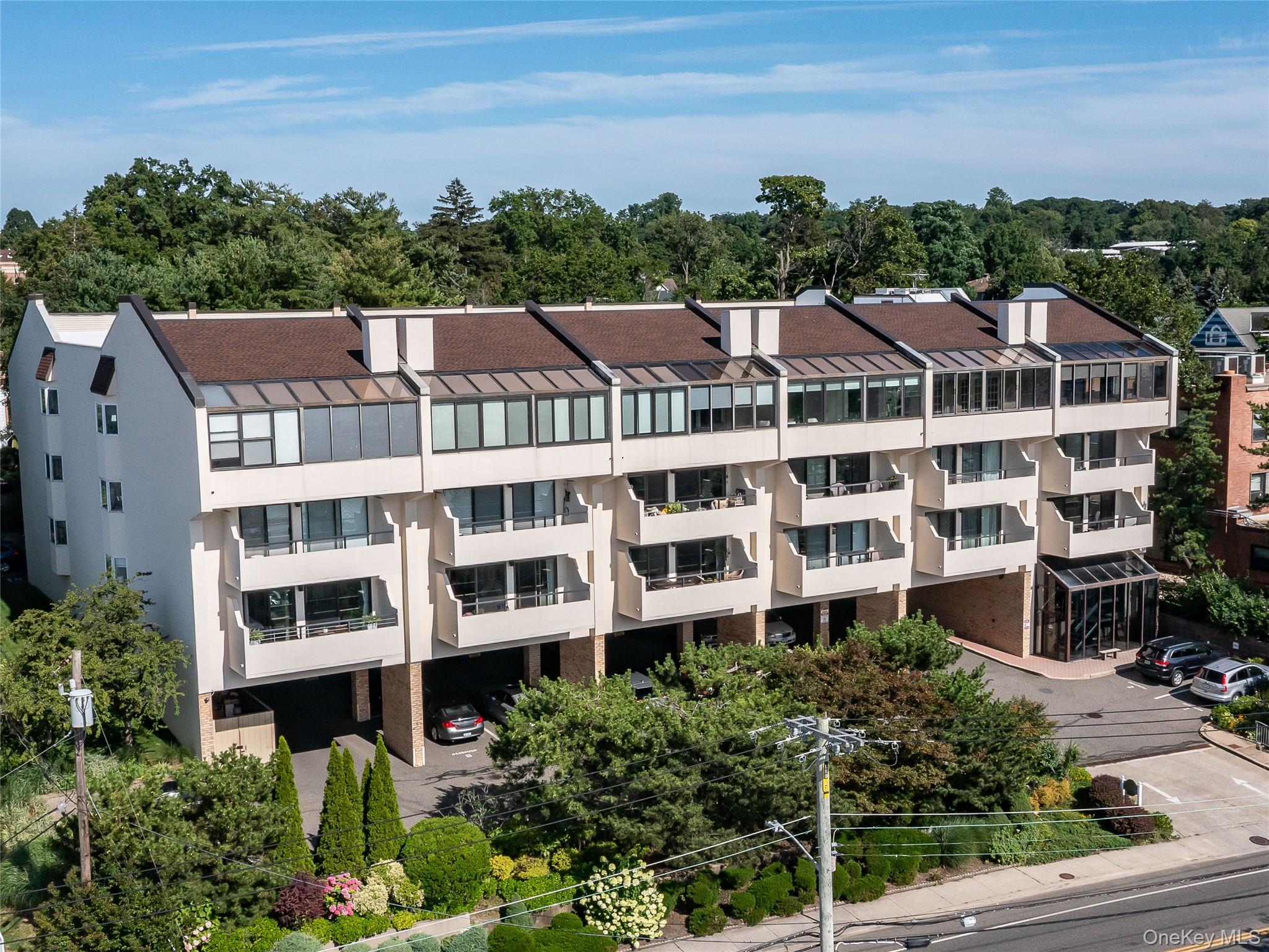 Experience waterside living at its best! Take in unobstructed views of Manhasset Bay from all principal rooms;  feel the breeze and enjoy the spectacular sunsets and city skyline from the private open air balcony in this 62+ Port Harbor condo. Featuring an open Lr/Dr Floor plan, spacious primary Br w/ ensuite bath and walk in closet. Secondary room has multiple possibilities, additional full hall bath, kitchen, and laundry room complete the space.  This unit has a designated covered parking space. Port Harbor has a community room w/ kitchenette and powder room, secure lobby w/ elevator and full time on site super. All this within close proximity to town, train, library, shops and amazing restaurants.