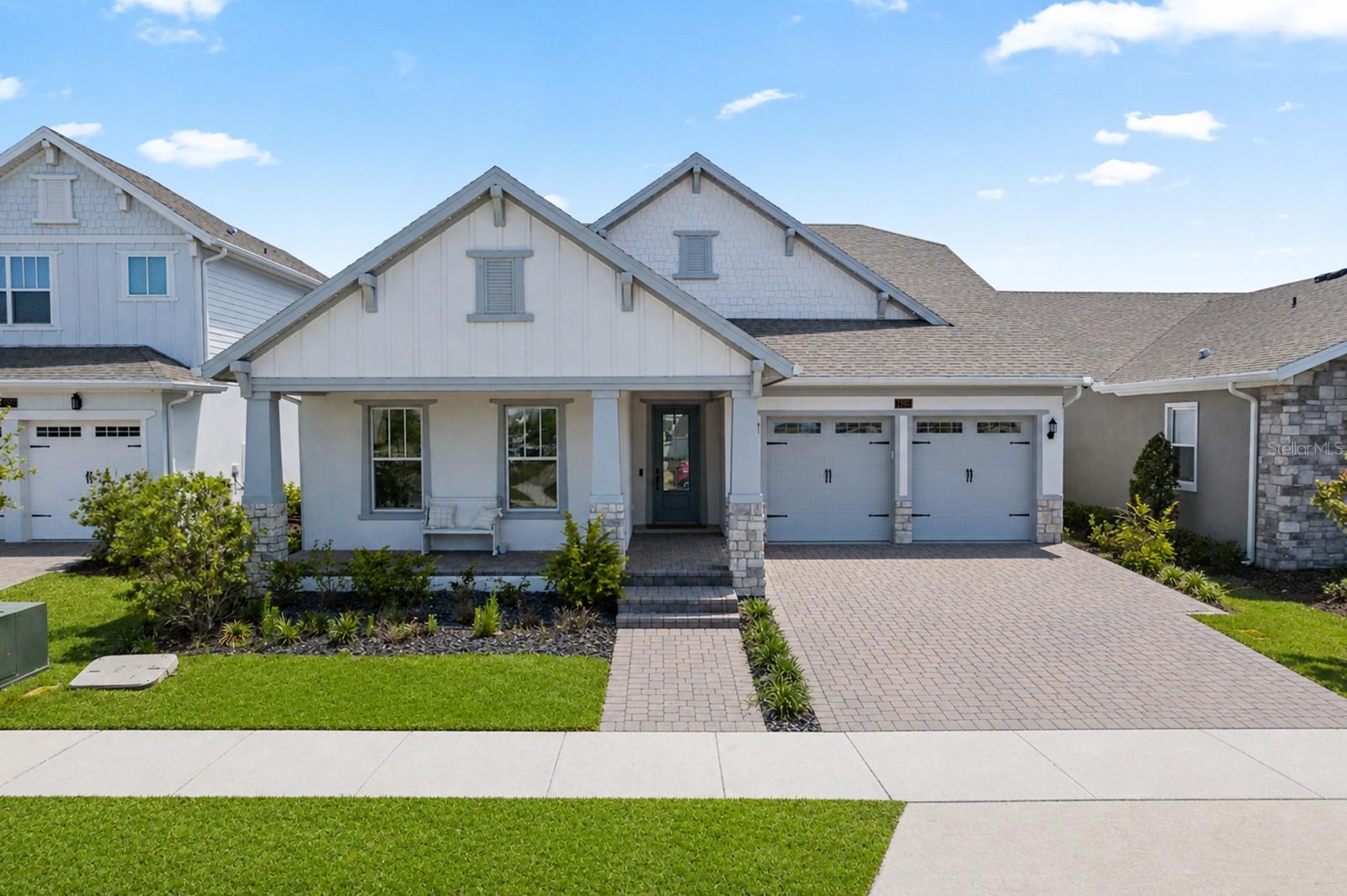 Welcome to a truly exceptional residence located in one of Orlando’s most desirable and conveniently positioned communities. This stunning 4-bedroom, 3-bathroom home offers a rare combination of privacy, high-end upgrades, and expansive living spaces designed for modern luxury living.From the moment you arrive, the elegant paver driveway and refined exterior create a striking first impression. Inside, the home opens to a bright and spacious layout with oversized rooms, high ceilings, and abundant natural light that enhances every detail.The heart of the home is a designer gourmet kitchen, featuring exquisite quartz countertops with a dramatic waterfall edge, premium cabinetry, and high-end finishes that deliver both beauty and functionality. The space flows seamlessly into the main living and dining areas, creating the perfect setting for entertaining and everyday living.A standout feature of this home is the private primary suite, thoughtfully designed as a peaceful retreat. Generously sized, it offers a serene and secluded atmosphere, complemented by a spa-inspired bathroom and ample closet space, providing both comfort and sophistication.The garage has been fully transformed into a versatile, climate-controlled space, featuring an insulated door and a high-efficiency ductless mini-split system. Finished with sleek epoxy floors and enhanced with custom lighting, this space is ideal for a private gym, executive home office, studio, or flex space—adding significant lifestyle value beyond traditional use.Additional upgrades include large-format porcelain and luxury vinyl flooring, smart home features, a finished attic for additional storage, a laundry room with sink, and thoughtfully selected finishes throughout the home.Step outside to a fully fenced private setting where elegant pavers extend your outdoor living space—perfect for entertaining, relaxing, or designing your future outdoor oasis. The home is also pre-wired for additional enhancements, offering flexibility for a pool.Ideally located just minutes from Orlando International Airport, major highways, Lake Nona, top-rated dining, shopping, and entertainment, this property offers both luxury and convenience in one of the fastest-growing areas of Central Florida.This is more than a home—it is a refined lifestyle opportunity where design, comfort, and location come together seamlessly.