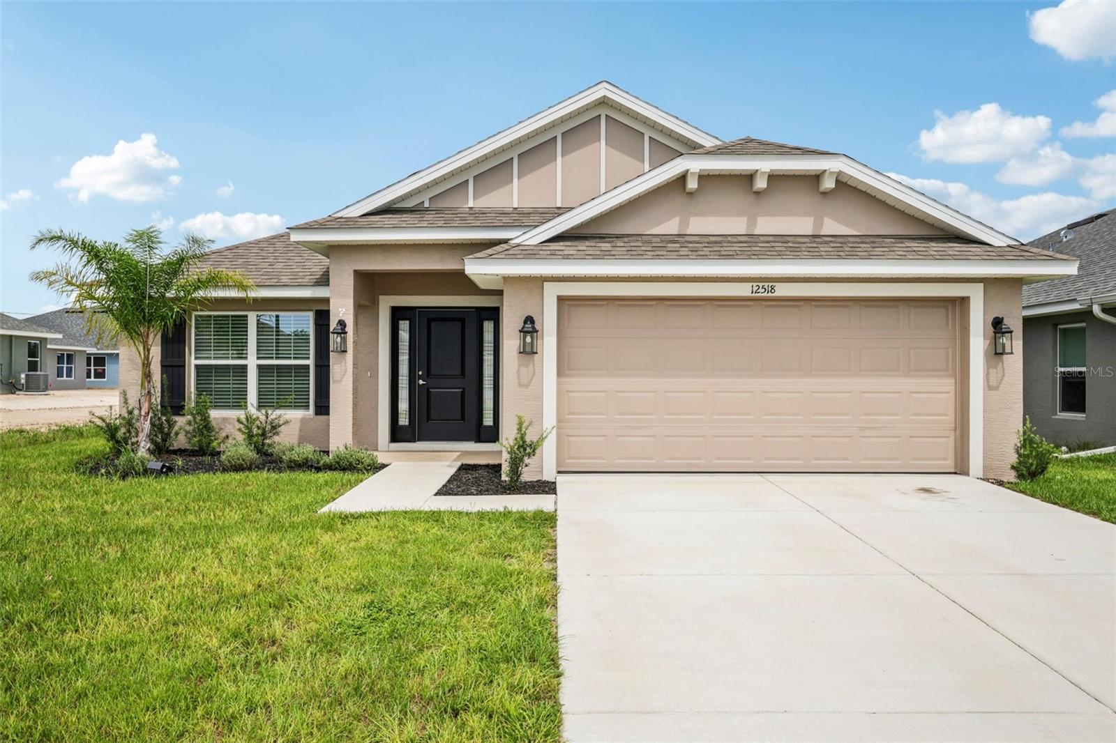 One or more photo(s) has been virtually staged. Two master suites – in this Almost brand-new home!  This beautifully built in 2024, this  
4-bedroom, 3-bathroom, 2-car garage home is only 1 year old, and it is truly move in ready. It’s an open floor plan, country style home with a welcoming entrance way and beautiful vinyl fenced in back yard. When you walk in the front door you will immediately feel at home. Beautiful matching neutral color counter tops, and wood cabinets in the kitchen and bathrooms. Complete black and stainless kitchen appliance package including the matching refrigerator. Tile in the kitchen, in all three bathrooms, and in the spacious inside laundry room. The master suite was upgraded with a trey ceiling, it’s spacious with room for a king-sized bed, the walk-in closet is huge, the master bath has dual vanities, water closet, linen closet and a tiled walk-in shower. This home is open and offers a true split bedroom floor plan. Bedrooms 2 and 3 share an exceptionally large, semiprivate Jack and Jill style bathroom. The 2nd master suite (in-law suite) is bedroom 4. Its spacious, has a large closet and its own private bathroom. Energy efficient A/C unit, dual pane windows throughout, and LED lighting all help keep the electric bill down. There are many items included in this home, that are not included in a new build including – the vinyl fenced in yard, fully screened in lanai, blinds built into the lanai door, ceiling fans, window coverings, expanded/ additional zones for the sprinkler system, Wi-Fi enabled garage door opener. The Pine Bluff subdivision is a new home community, perfectly located towards the center of Spring Hill. There are NO CCD fees, and a very low HOA fee – to help maintain standards and property values in the community. This home is currently vacant and is truly 100% move in ready.  Call for your private tour today, and if you have any questions – Just ask. (All measurements are approximate)
