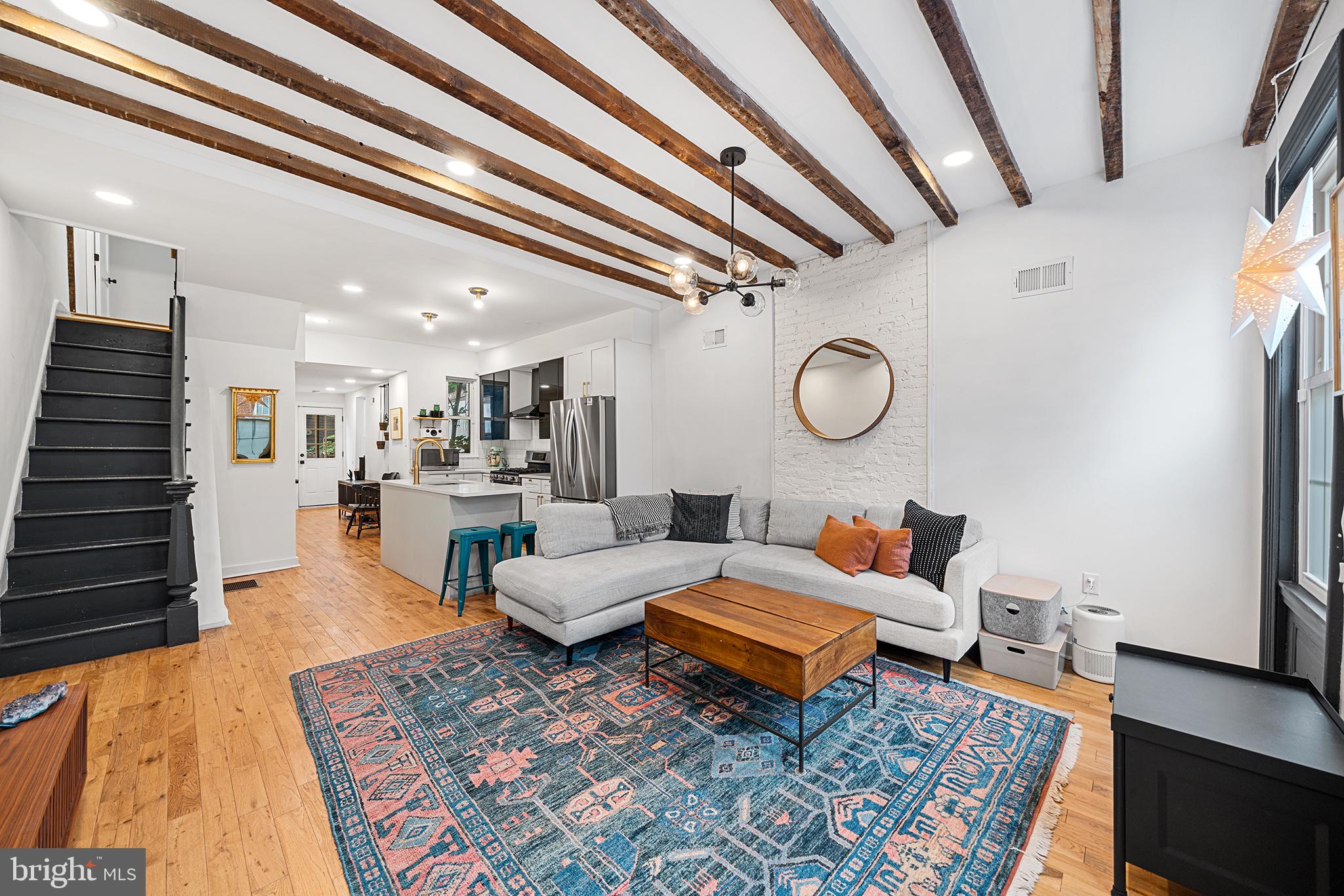 *SHOWINGS START 9/19* Looking for that perfect mix of architectural charm, designer finishes and modern convenience? Welcome to sunny and spacious living at 1920 Ellsworth! Enjoy the best Point Breeze and Graduate Hospital have to offer in this bright, move-in ready 3 bed, 2.5 bath home located 2 blocks from Washington Ave. At 16 ft wide, this beauty boasts high ceilings with exposed wood beams, incredible natural light and an open layout featuring a central kitchen with spacious separate living and dining areas. The cheery kitchen features quartz countertops, stainless appliances and an island for extra prep. The dining room has thoughtful banquet bench seating and 2 large windows. An adorable powder room with a custom sink is conveniently tucked behind the dining room on the way to the private back patio. Whether you’re inside or out, this stunning home has a great flow and plenty of room to entertain. Upstairs the tasteful finishes and wood floors continue through 3 spacious, sun-drenched bedrooms.The primary suite (located in the front of the home) features an en-suite bathroom. The other 2 bedrooms share the full bathroom in the hallway which includes a deep bathtub and skylight. All bedrooms have closets and the rear bedroom features more exposed ceiling beams. The finished basement allows for an additional living room, gym, and/or playroom and has plenty of storage and hobby space. Location is key! Enjoy walkability and bikeability to Center City, while being located right around the corner from all the retail and development on Washington Ave (Planet Fitness, Sprouts, Target, Breezy’s Deli & Market, Aldi’s, Tuck Barre & Yoga, CVS, Washington Ave Animal Hospital). This gem of a home is also only a 10 minute walk from the Ellsworth/Federal stop on the Broad street line (making heading the the Phillies or Eagles games a breeze) and is perfectly situated to enjoy both Point Breeze and Graduate Hospital- where coffee shops, bars and restaurants are within blocks (Dockstreet Brewery, Ultimo Coffee, Sidecar Bar & Grill, Schmaltz, American Sardine Bar, Greenstreet Coffee). With the added benefit of a renovation tax abatement (5 years remain), you can move right in to 1920 Ellsworth street and thrive in this well-maintained home with lower taxes for years to come.