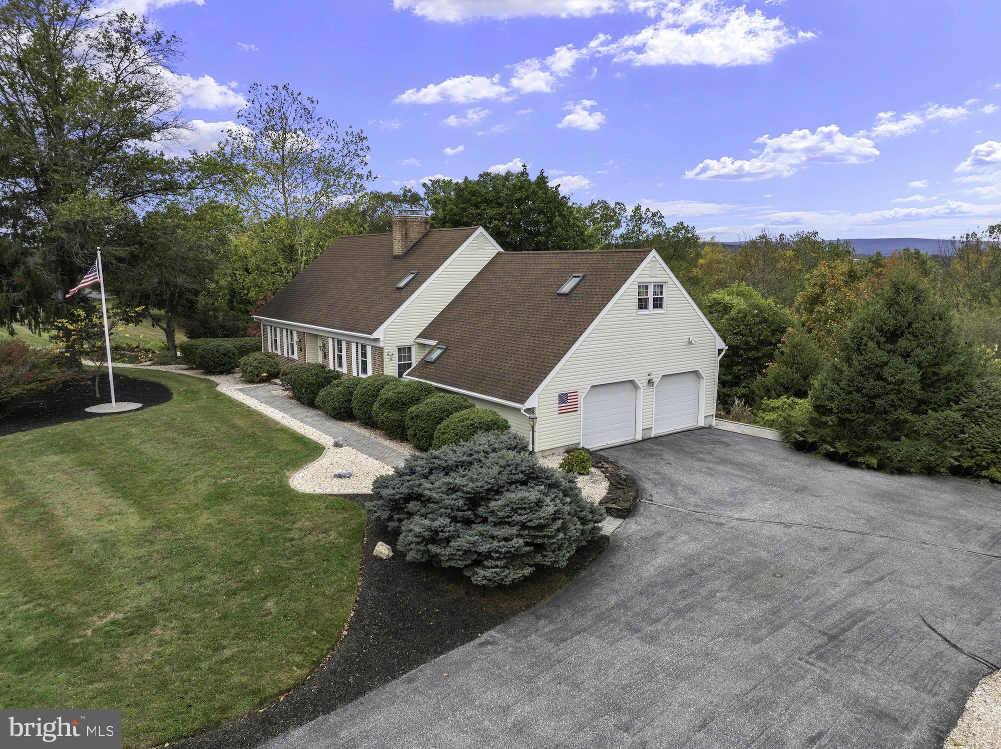 Beautifully maintained Cape Cod offering 2,529 sq. ft. of comfortable living space on 4.95 acres just 3 miles from Historic Gettysburg and 7 miles to Liberty Resort & Gettysburg Golf Club. This versatile home features 3–4 bedrooms or a bonus room, 3 full and 2 half baths, and a partially finished walk-out basement with a family room and large workshop area. Enjoy abundant storage, a spacious 2-car garage, and a large private deck perfect for outdoor entertaining. The inviting sunroom, complete with heat and A/C and direct deck access, provides year-round enjoyment. Recent updates include new windows and skylights, water heater 2018 and HVAC 2023. Beautiful landscaping and numerous perennials surround this property, creating a peaceful and picturesque setting.