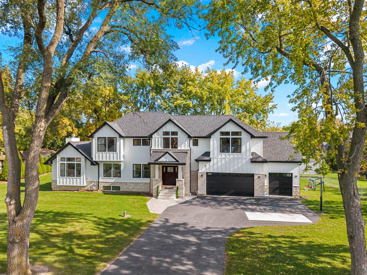 Welcome to this modern elegance in newly completed home within the Schaumburg School District. Built from the ground up, with only a portion of the existing foundation retained, this stunning residence offers 4 bedrooms, 3.5 bathrooms, and thoughtfully designed living spaces throughout.  Abundant windows fill the open floor plan with natural light, while high ceilings and hardwood floors create a warm, inviting atmosphere. The beautifully appointed kitchen features custom cabinetry, stainless steel appliances, and quartz countertops, flowing seamlessly into a spacious living room anchored by an elegant fireplace. A convenient mudroom provides additional storage.  Upstairs, the impressive primary suite features vaulted ceilings, two walk-in closets, and a luxurious bathroom with double vanities, a walk-in shower, a bathtub, and heated flooring. Three generously sized additional bedrooms, a second-floor laundry room, and a hall bathroom with double vanities, a bathtub, and heated flooring complete the upper level.  The finished basement offers versatile space for a home theater, fitness area, recreation room, or whatever suits your lifestyle. A three-car garage provides ample parking and storage, while the expansive backyard offers plenty of room for outdoor entertaining, recreation, and quiet relaxation.  Experience the comfort, style, and thoughtful details this exceptional home has to offer. Schedule your private showing today!