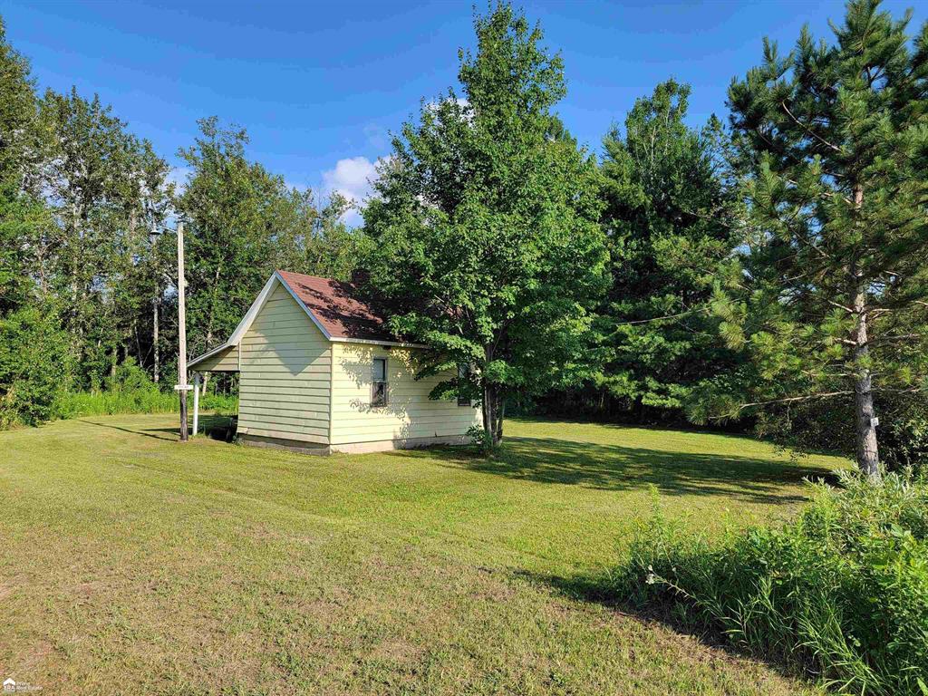 Don't miss your opportunity to own this vast 80 acres with frontage on a paved road and minutes from all of the shopping and restaurants West Branch has to offer.  Excellent deer hunting.  Four of the six deer blinds stay with the property.  Equipped with a hunting cabin complete with bunk beds and electricity.  Formerly known as Whiskers Hunt Club.  There is also a shed on the property for extra storage.  Hand pump on property.  Mineral rights are owned.  Perfect for a weekend getaway or site for a future home.  Will consider splitting property into two 40 acre parcels.