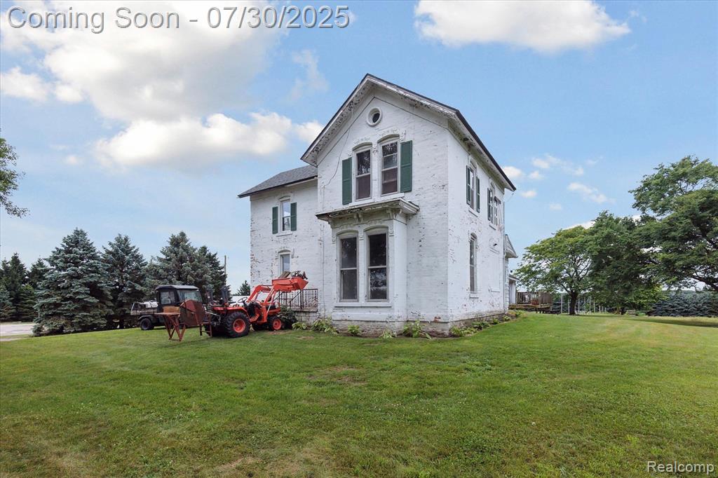 Discover a rare opportunity to own a piece of Michigan’s rural charm just minutes from the freeway at 3435 Dietz Rd, Williamston. This historic farmhouse sits on a working garlic farm and is surrounded by a collection of functional outbuildings, including a gothic-style event barn, milk barn, shed, and spacious vehicle workshop—perfect for agricultural, creative, or commercial use.

The stately farmhouse offers flexibility for dual-purpose living. Continue its transformation as a live/work space—business downstairs, residence above—or easily convert it back into a full family home. The upstairs is well-positioned for private living quarters, while the main floor is ideal for retail, tasting room, studio, or office use.

A major bonus: current tenant Michigan Brewing Works would like to remain, offering built-in rental income from an established, local craft brand.

The showstopping gothic-style barn adds even more value with its dramatic architecture and strong rental appeal. It's ideal for weddings, farm-to-table dinners, or seasonal markets. The surrounding acreage provides ample parking, farming space, and room for future growth.

Whether you're an entrepreneur, investor, or someone looking for a one-of-a-kind country retreat with income potential, this property blends heritage, versatility, and location into one exceptional offering.