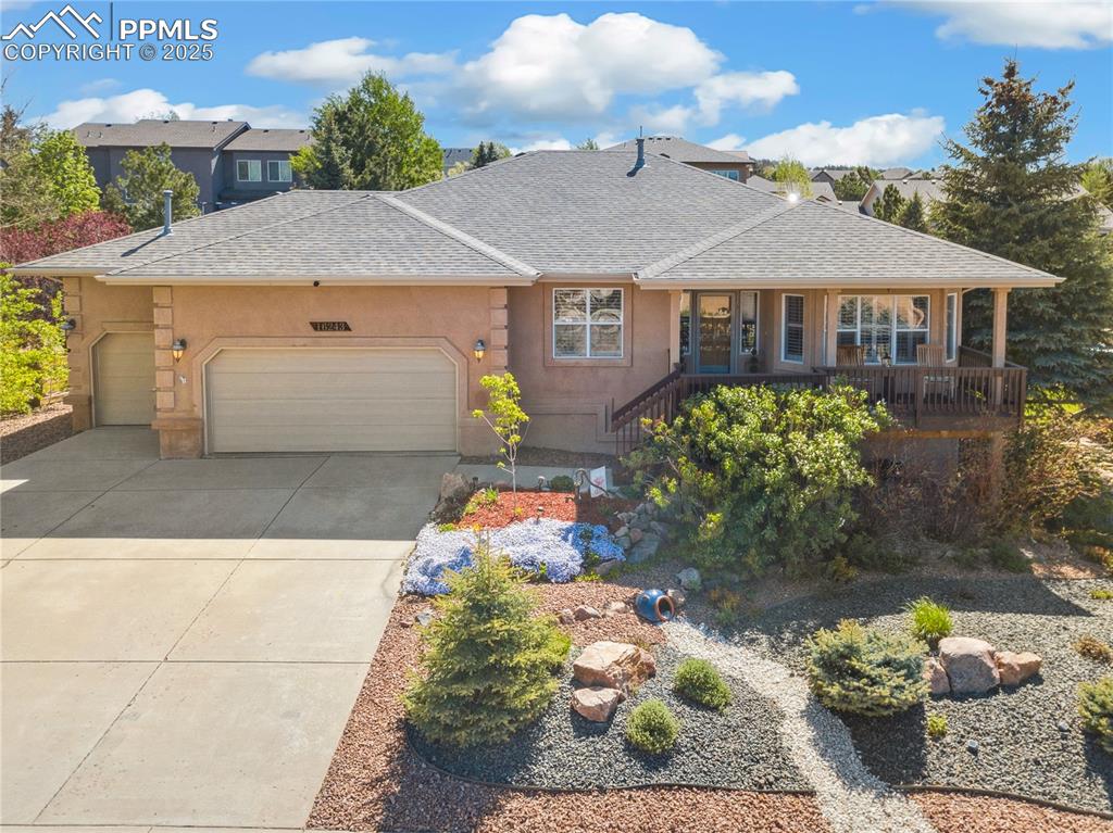 Pride of Ownership is Evident! Enjoy the Incredible Views from the Spacious Front Deck that Greets You as You Enter This Well Cared For Home. The Open Concept, Main Level Living Floorplan is Sure to Delight! Featuring 4 Bedrooms, a Main Level Office with Built-in Cabinets and 3 Full Bathrooms. The Spacious Kitchen Serves Up Gorgeous Hickory Cabinets ~ Brand New Stainless Appliances ~ Walk-in Pantry and a Spacious Island featuring a brand  new sink! The Cheerful Dining Area Boasts a Stunning Bay Window Welcoming in Tons of Natural Light and Walks out to the Composite Deck Overlooking the Inviting Backyard ~ As you Enter the Adjoining Living Room, You are Greeted with a Handsome Gas Fireplace ~ Custom Accents Throughout the Home to Include Hand Troweled Walls (freshly painted) ~ Whimsical Stained-Glass Window ~ Tile work ~ Hickory Floors and Plantation Shutters. The Newly Carpeted Owners' Suite is Your Own Private Oasis with a Tray Ceiling and En Suite Bathroom with Brand New Luxury Vinyl Plank, Soaking Tub and Separate Shower, as well as an Enormous Walk-in Closet with Custom Shelving! A Full Bathroom, Guest Bedroom, and Laundry Room Finish out the Main Level!  Walk-out Basement Plays Host to an Impressive Family Room/Recreation Room ~ Plumbed for a Gas Fireplace ~ Gorgeous Built-in Desk ~ Charming Pellet Stove for those Cool Colorado Evenings ~ Whole House, Surround Sound Speakers ~ Two, Freshly Painted, Large Bedrooms (one with huge walk in closet) and a Full Bathroom, Lastly a Huge Storage Room w/Cherry Wood Built in Cabinets/Desk. The Fully Fenced Backyard has so Many Bonuses ~ Hook up for Natural Gas Grill ~ Fire Pit Area and Fenced in Dog Run!  3-Car Garage Heated with 12 ft. Ceiling with Overhead Storage Loft, and Built in Cabinets. A/C and Hepa Filtration System on Furnace, Professionally Landscaped/Xeriscaped. Across the Street from a Park ~ Schools and Shopping ~ Awarding Winning District 38!  Welcome Home!