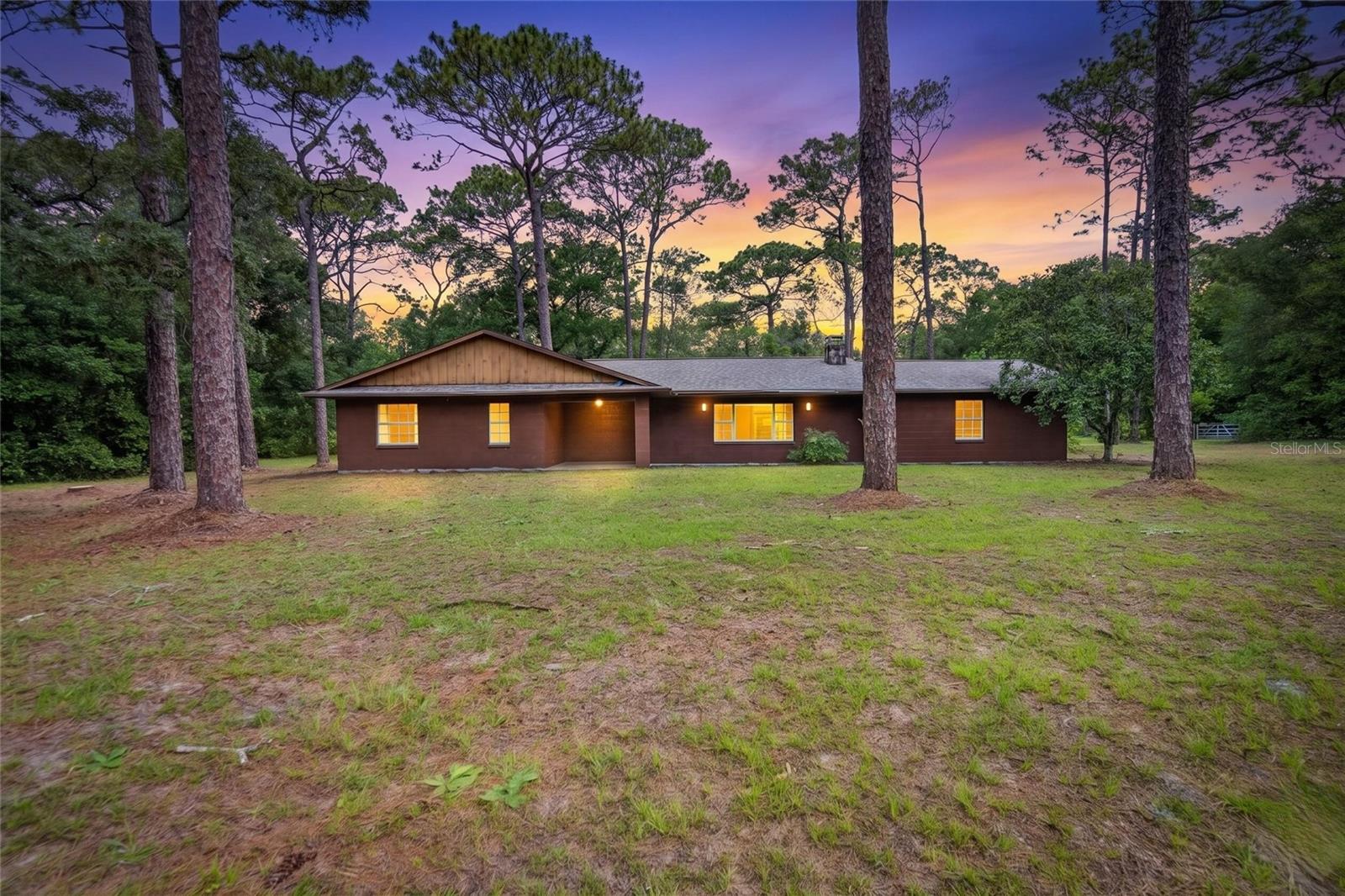 Tucked away on 5.8 private acres in the heart of Brooksville, this charming 2-bedroom, 2-bath home offers the perfect blend of peaceful country living and everyday convenience. Built in 1980, the home features 1,332 square feet of inviting living space with a warm, comfortable layout, cozy wood burning fireplace, and plenty of room to relax and unwind. A spacious 2-car garage and detached 22' x 12' workshop provide ample space for storage, hobbies, tools, or projects. Surrounded by mature trees and natural beauty, the expansive property offers endless possibilities for gardening, outdoor recreation, animals, or creating your own private retreat. Enjoy the serenity of rural living while still being just a short drive from shopping, dining, and major roadways. Whether you’re searching for a full-time residence, weekend getaway, or investment opportunity, 15337 Virts Ave delivers privacy, charm, and incredible potential in a beautiful Brooksville setting.