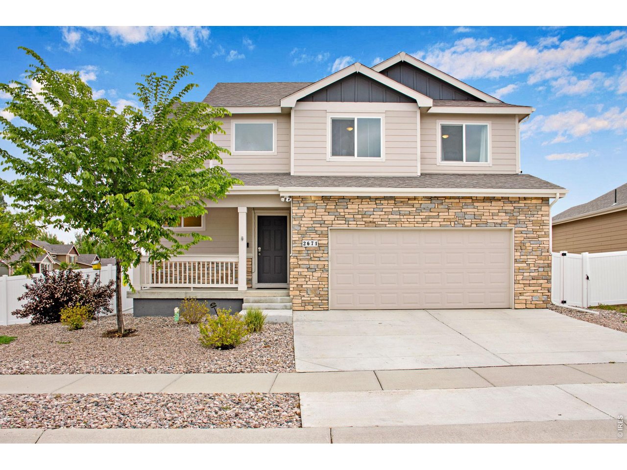 Welcome home to this thoughtfully designed two-story home situated on a desirable corner lot, offering 3 bedrooms, and 2.5 baths, plus an unfinished, plumbed in basement ready for future expansion or storage! The main level features an open and inviting layout with a spacious great room flowing seamlessly into the kitchen and dining area, creating the perfect setting for everyday living and entertaining. The living room impresses with soaring vaulted ceilings and an abundance of natural light, creating an airy, welcoming atmosphere throughout the home. Venture upstairs to the sizable primary suite, offering a relaxing retreat complete with an expansive walk-in closet and remodeled tile shower. The laundry room is conveniently located upstairs with the bedrooms and includes a practical wall-to-wall folding counter for added functionality. Enjoy outdoor living from the charming covered front porch or back patio, both designed to make this home feel warm, welcoming, and well suited for entertaining. The tandem garage provides valuable extra storage space or room for additional vehicles and gear. Located between Loveland and downtown Johnstown with quick and easy access to I-25, this home combines comfort, convenience, and thoughtful design in a highly desirable location! * Assumable VA loan option for qualified buyers.*