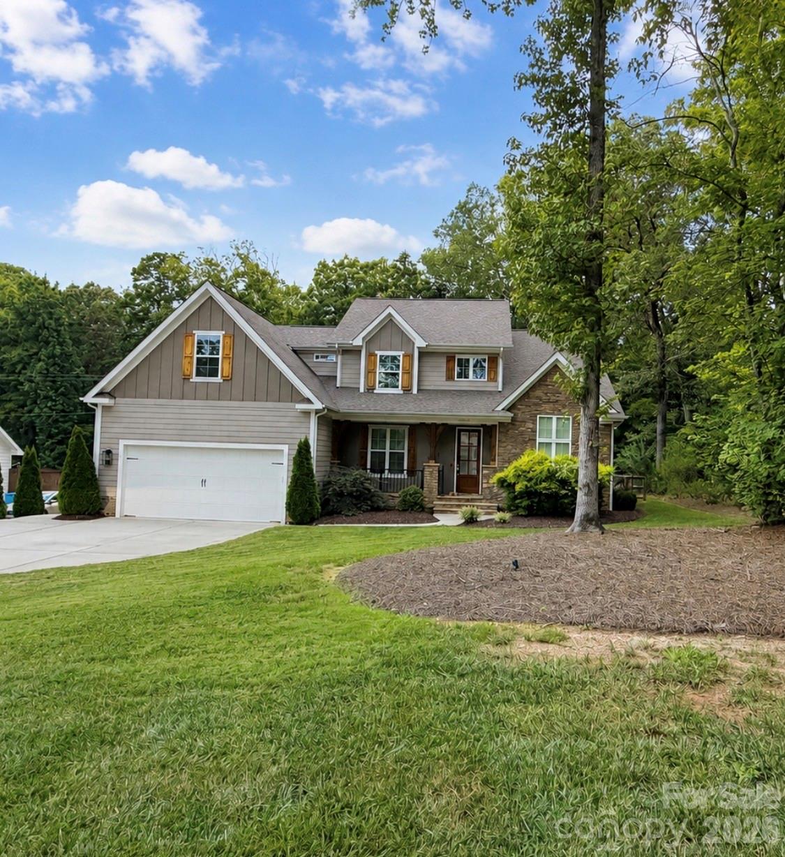 Welcome to this beautiful semi-custom home situated on over an acre in the desirable Rosewood Trail community of Midland! Offering 4 bedrooms, 3.5 baths, and a spacious, thoughtfully designed floor plan, this home combines custom details with the peaceful feel of country living. From the moment you step inside, you’re greeted by a beautiful staircase that makes an impressive first impression. The spacious great room features soaring ceilings, hardwood floors, crown molding, shiplap accents, and a stunning stone fireplace. The kitchen is designed for both everyday living and entertaining with custom white cabinetry, a large island, breakfast area, beautiful backsplash, and dark leathered granite countertops. A separate dining room provides additional space for hosting family and friends.The main-level primary suite offers a relaxing retreat with a spa-like bath featuring a freestanding tub and rain shower. Upstairs, you’ll find three additional bedrooms, two full baths, and a HUGE bonus room offering plenty of flexibility for a media room, playroom, home office, or additional living space.Outside, enjoy the beautifully maintained yard, mature trees, peaceful natural surroundings, and a back deck perfect for entertaining or simply enjoying the beautiful country setting. Additional features include a tankless water heater and access to the Rosewood Trail community walking trail. Enjoy the privacy and space of over an acre while remaining conveniently located near shopping, restaurants, and grocery stores, with easy access to Charlotte, Concord, Mint Hill, Locust, and Albemarle. This home offers the perfect combination of space, beautiful finishes, convenience, and peaceful country living!