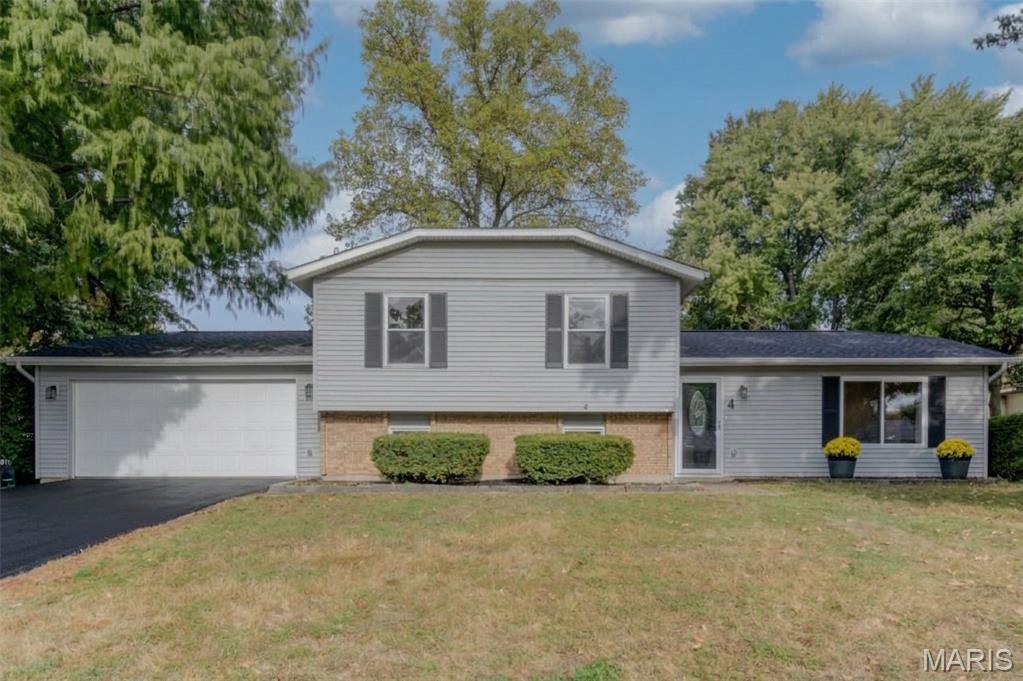 OPEN HOUSE Sun. 11/1 1-3 PM. A RARE FIND! Impeccably maintained and truly move-in ready, this exceptional St. Peters home combines an inviting cul-de-sac setting, outstanding improvements and wonderful spaces for relaxing and entertaining. The fantastic screened porch with striking vaulted wood ceiling overlooks a delightful backyard with white vinyl fencing, mature trees, underground electric to pool and attractive landscaping and hardscapes. Simply impressive! Enjoy an oversized, drywall-finished two-car garage, low-maintenance vinyl siding, enclosed soffits and fascia, gutter guards, updated garage door, thermal windows and sliding doors plus two sheds. Major updates include a high-efficiency HVAC system (2026) and upgraded architectural roof (April 2026). Inside, gorgeous wood flooring, an open floor plan and striking wrought-iron railings set the stage for a spectacular updated kitchen featuring beautiful 42” wood cabinetry with crown molding, solid-surface counters, undermount sink, stainless appliances, recessed lighting and a six-foot butterfly breakfast island/bar. The adjoining living and dining rooms create an inviting flow for everyday connected living and entertaining. The handsome stone wood-burning fireplace, storage cabinets and closet, great natural light, more recessed lighting and handsome COREtec waterproof luxury vinyl plank floor make the family room a standout. The primary suite offers a spacious walk-in closet with custom organizers and a private full bath. Additional highlights include luxury vinyl plank flooring in the lower level and upper hallway, neutral carpet, ceramic tile in the screened porch, updated baths, modern lighting and ceiling fans, Wi-Fi thermostat, kitchen water filtration system, upgraded garbage disposal, 50-gallon water heater, six-panel doors with lever handles and an etched-glass front storm door. The finished laundry room boasts streaming natural light and abundant extra storage. Enjoy a quiet street with incredible convenience to major roads, highways, schools, shopping and restaurants. Beautifully cared for, thoughtfully updated and ready to enjoy—this may be EVERYTHING on your wish list!