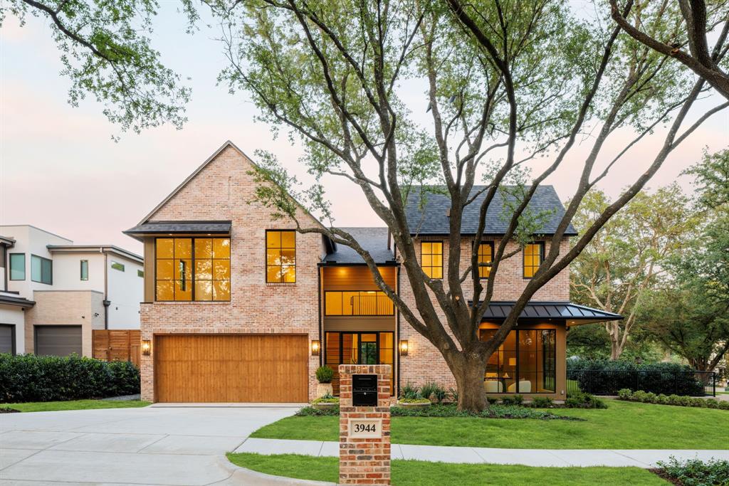 Located on a tranquil,tree-lined street in one of Lakewood’s most coveted neighborhoods,this stunning custom home by Fairmont Homes exemplifies refined transitional design.Positioned on a rare .30-acre private corner lot,the residence highlights exceptional craftsmanship,thoughtfully curated finishes,& premier amenities—delivering an elevated lifestyle just steps from the shores of White Rock Lake.Majestic,towering live oaks surround the home,while the rich patina of natural brick & lush landscaping evoke a timeless,established presence.Inside, soaring 11-foot ceilings & dramatic floor-to-ceiling windows create a light-filled,open atmosphere. Warm,inviting tones carry throughout,complemented by white oak hardwood floors,beautiful millwork,& smooth-finished walls with subtle plaster detailing.The kitchen is a true showstopper,featuring top-of-the-line Thermador appliances,a pantry that exceeds expectations,& a phenomenal banquette breakfast nook designed for everyday elegance.From the kitchen, white oak portals lead into the inviting family room,anchored by a striking fluted concrete fireplace.The space flows effortlessly into the dining room, complete with a sleek wet bar & integrated wine storage.With an effortless indoor-outdoor flow, both the kitchen and family room open via sliding doors to the expansive rear loggia overlooking the pool.Complete with an outdoor kitchen,phantom screens,& in-ceiling heaters,the space is perfectly designed for comfortable entertaining in every season.The sleek modern pool is paired with a huge turf yard,creating a resort-like retreat visible & accessible from the living & dining areas.The study captures sweeping views + private spacious guest retreat.Upstairs you will find the incredible primary suite with spa inspired bath + three spacious secondary bedrooms—each with its own en-suite bath & walk-in closet—alongside an impressive game room & a versatile flex space, ideal for a home gym or second office.Oversized 3 Car Garage