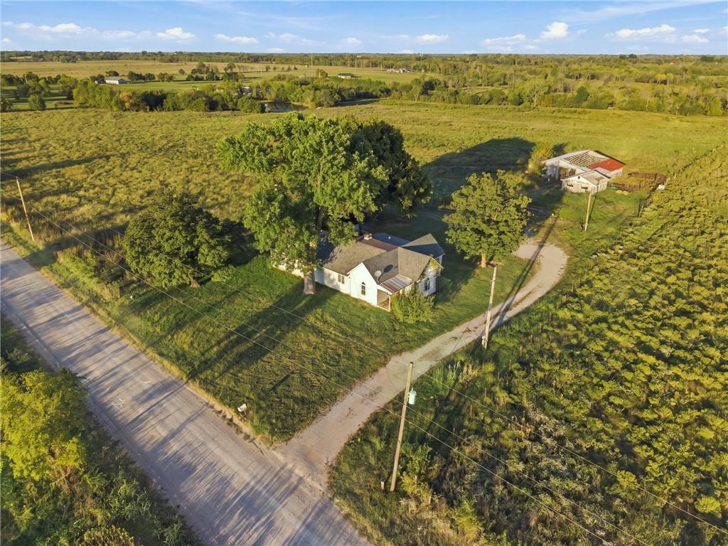Country living on 40 acres, ready for a little TLC. This 3 bed, 2 bath country home sits on an attractive 40 acre tract with a pond and perimeter fencing, giving you room for livestock, homesteading, or simply space to spread out. The home is a light fixer-upper with a solid footprint and plenty of potential for someone ready to add their own updates and finishes. Central heat and air keep it comfortable year-round, and the wood stove adds warmth and cozy appeal on cold Kansas nights. The 50x60 shop is a bonus, with plenty of space for equipment, projects, storage, or business operations. With fencing already in place and a pond on the property, much of the groundwork is done to make this rural property work for your lifestyle, you just need to put the finishing touches in place. If you've been looking for acreage outside of town, with a home and shop, at a price that leaves room for sweat equity, this one is worth a look. Call today to schedule your private showing!