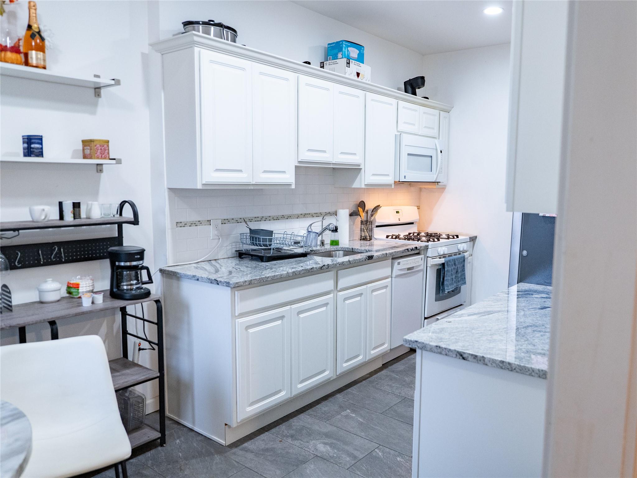 Spacious 2-bedroom co-op in the heart of Hartsdale! This oversized unit offers approximately 1,200 sq. ft. of living space, featuring a kitchen with granite countertops, recessed lighting, wood-grain tile flooring, and a decorative tile backsplash. The bathroom includes both a separate bathtub and a stand-alone shower. Enjoy ample storage with four large closets! The living room is enhanced with custom motorized blinds and this unit comes with an assigned parking space. 

Hartsdale Gardens is a beautifully maintained prewar building with a live-in superintendent and a full-time porter, ensuring a spotless environment. Residents can take advantage of amenities such as a playground, basketball court, BBQ/picnic area, and a full-size card-operated laundry facility with carts. Conveniently located just minutes from Hartsdale Village and the the Hartsdale MetroNorth station with an easy 35-minute train ride to Grand Central Terminal. Nearby shopping includes Trader Joe’s, Starbucks, and Home Goods