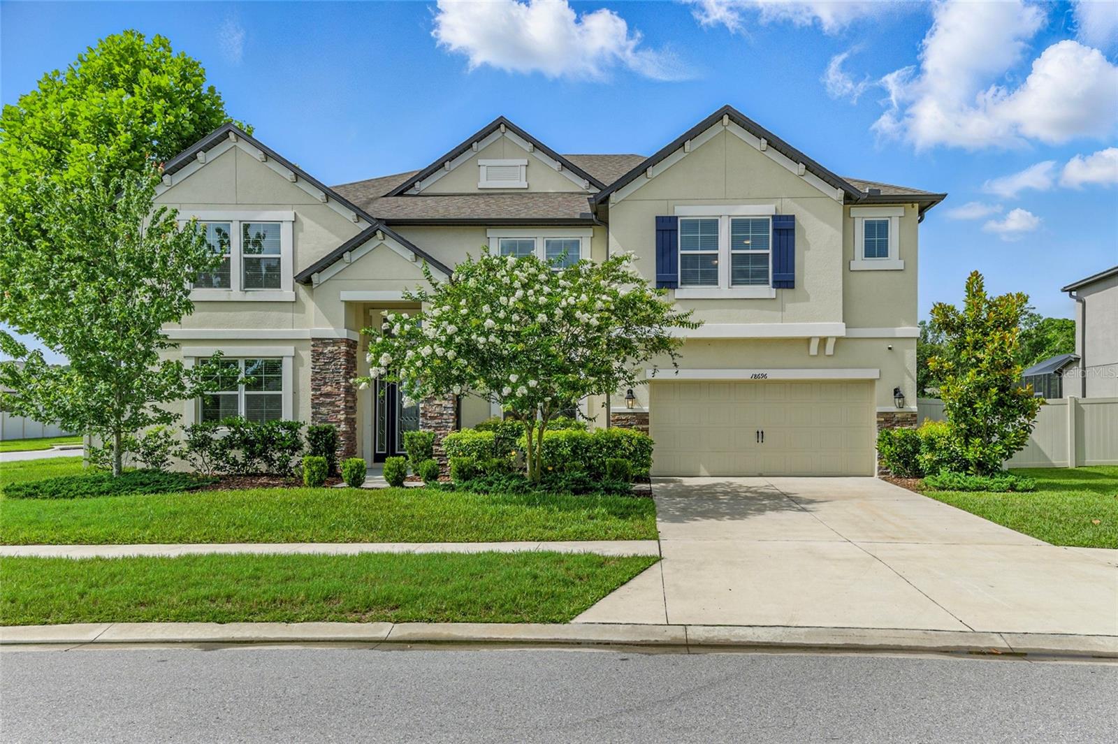 **Seller is willing to contribute $10,000 toward buyers closing costs and/or pre-paids!** Luxury awaits in this one-of-a-kind 6-bedroom, 4 full bath, 2 half bath M/I Homes Renato "C" model, THE LARGEST FLOOR PLAN IN TALAVERA, offering 5,452 square feet of living space on an oversized 0.25-acre corner homesite. Built in 2019, this home is an entertainer’s dream, boasting a large saltwater pool with heated jacuzzi spillover feature, extended trussed lanai and a screened enclosure. From the stone exterior and pristine landscaping to the elegant interior finishes, no detail has been overlooked. The first floor features a spacious owner's suite with direct pool views, tray ceiling, two walk-in closets with built-in systems, linen closet, a luxurious en-suite bath with dual quartz vanities, garden tub, separate water closet and glass-enclosed shower with listello tile. The gourmet kitchen showcases upgraded 42-inch upper cabinets, quartz countertops, tile backsplash, oversized island, upgraded stainless steel appliances, built-in oven, butler’s pantry and custom shelving built into the walk-in pantry. The expansive first floor has all tile flooring and a private guest suite and full bath with separate pool access, formal dining room, den/office, half bathroom and storage closets. The sprawling engineered hardwood staircase leads right into the expansive game room with tray ceiling and engineered hardwood flooring, includes a full wet bar featuring quartz counters, sink, bar fridge and is flanked by multiple bedrooms—each with their own walk-in closets. A separate media room is equipped with built-in surround sound speakers and floor outlets. Bedroom 6 functions perfectly as a second primary or in-law suite. Additional highlights include: two Jack and Jill bathrooms with quartz vanities and separate water closets, two laundry rooms with built-in 42 inch upper cabinets (upstairs and downstairs), a 3-car tandem garage with pedestrian door, pre-plumbing for an outdoor kitchen, gutters  and thoughtfully placed A/C and pool equipment for peaceful poolside lounging. Located in the highly desirable Talavera community with resort-style amenities including a zero-entry pool, splash pad, clubhouse, tennis and basketball courts, and regular food trucks. Enjoy easy access to US-41, SR-52 and the Suncoast Parkway. Schedule your private showing today—this one has it all!
