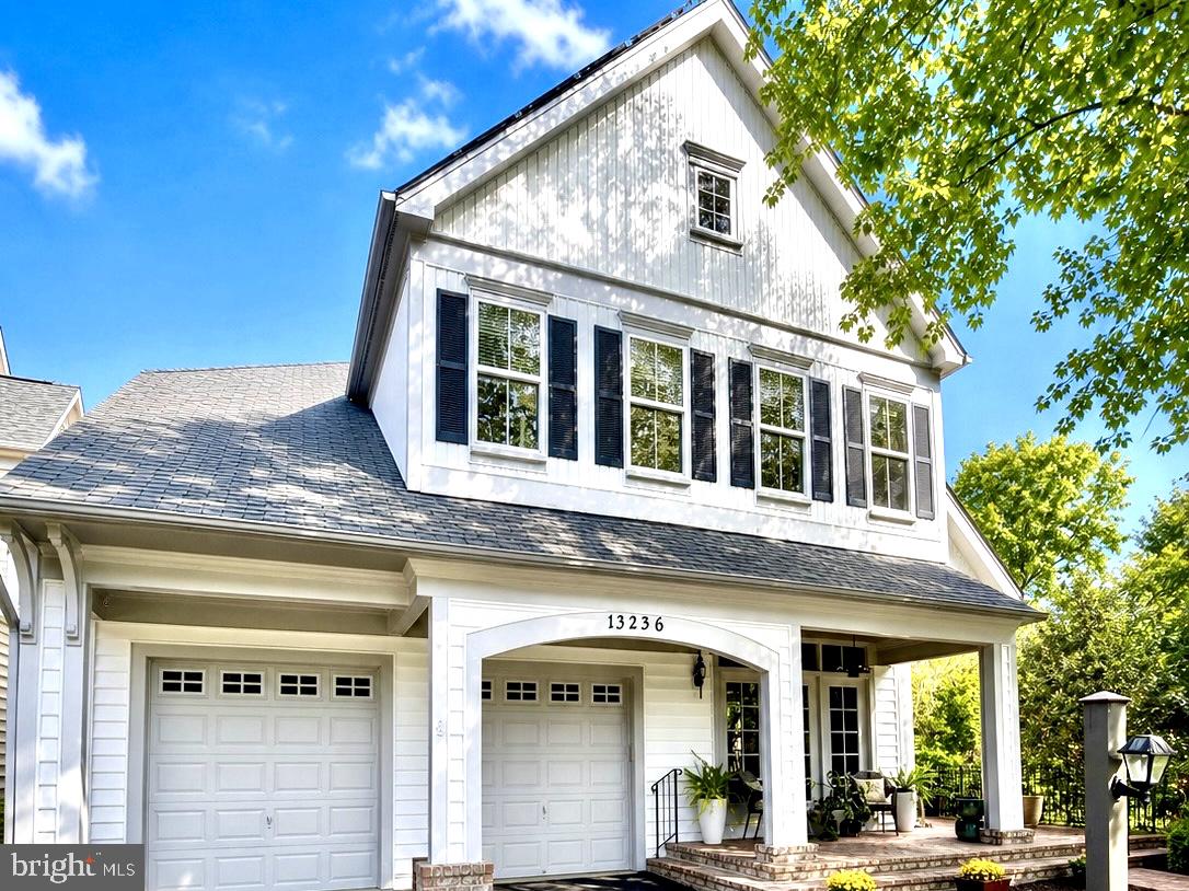 Modern Farmhouse with Rare Main-Level Suite, Walkout Living, and Energy Savings—Cul-de-Sac Setting in Parkside.  Welcome to this thoughtfully upgraded “modern farmhouse” tucked on a quiet cul-de-sac in the Parkside community of Clarksburg—where tree-lined streets, a tucked-away setting, and a genuine sense of space create a neighborhood that simply feels right, while remaining minutes to I-270, Route 355, shopping, parks, and top-rated schools.From the covered front porch to the light-filled interior, the home blends classic detailing with modern function—hardwood floors, high ceilings, crown molding, and a layout designed for both everyday living and effortless entertaining.The updated kitchen anchors the home with a large island, granite countertops, white cabinetry, double ovens, and a new induction cooktop (2025)—opening seamlessly to the family room with a fireplace for a true gathering space.A standout feature—and rare in this community—is the main-level bedroom with a full bath, offering exceptional flexibility for multigenerational living, guests, or a private office suite.Upstairs, the spacious primary suite includes a sitting area, walk-in closet, and spa-style bath with dual vanities, soaking tub, and separate shower. Secondary bedrooms are generously sized with hardwood flooring, and a full-size laundry room adds convenience.The fully finished walkout lower level significantly expands the living space with a recreation area, bedroom, full bath, and a secondary kitchenette/bar—ideal for extended stays, entertaining, or flexible living arrangements. The walkout leads to a stone patio and a larger, elevated lot that offers privacy and a sense of openness rarely found in the neighborhood.Additional highlights include:Solar panel system delivering ongoing energy efficienciesTwo-zone HVAC (meticulously maintained)Whole-house humidifierSecondary washer/dryer and refrigerator in the lower levelLocated near Clarksburg Outlets, parks, dining, and local vineyards and farms—this home offers a compelling blend of comfort, flexibility, and long-term value. Make your appointment today!