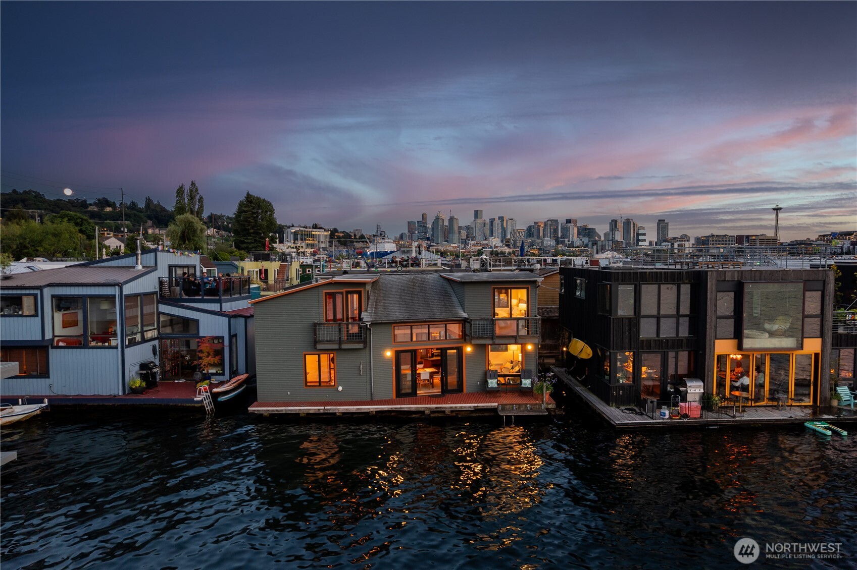 Ready to live your best life? Beautifully designed floating home by LaPatra Architects in the heart of energetic Eastlake.  Living room, kitchen & dining room are open concept with soaring ceilings and open up to waterside deck.  This house is full of thoughtful built ins, but still feels open and wide.  Three bedrooms are all separated for privacy, handy utility room and closets for storage, decks off upper bedrooms, upscale finishes like artful floating staircase, beams, steel, and beautiful woodwork. Tranquil home with views from all rooms of lake, mountains, & Gas Works park.  Lots of room for a boat here, too! This co-op dock has it's own parking lot and is quite charming.  Come live life afloat in one of the coolest neighborhoods!
